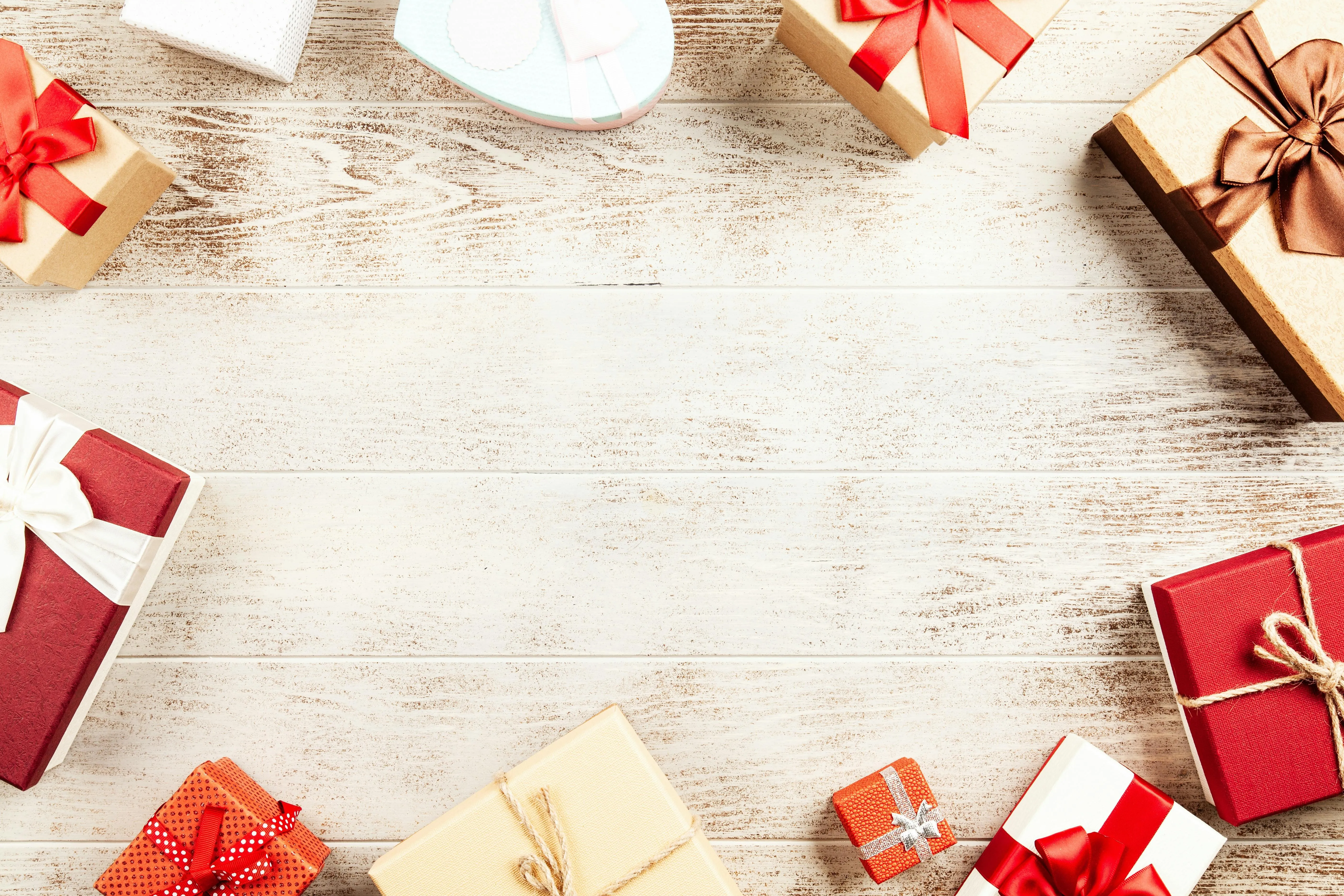 Flat lay of gift boxes on rustic white wooden table image