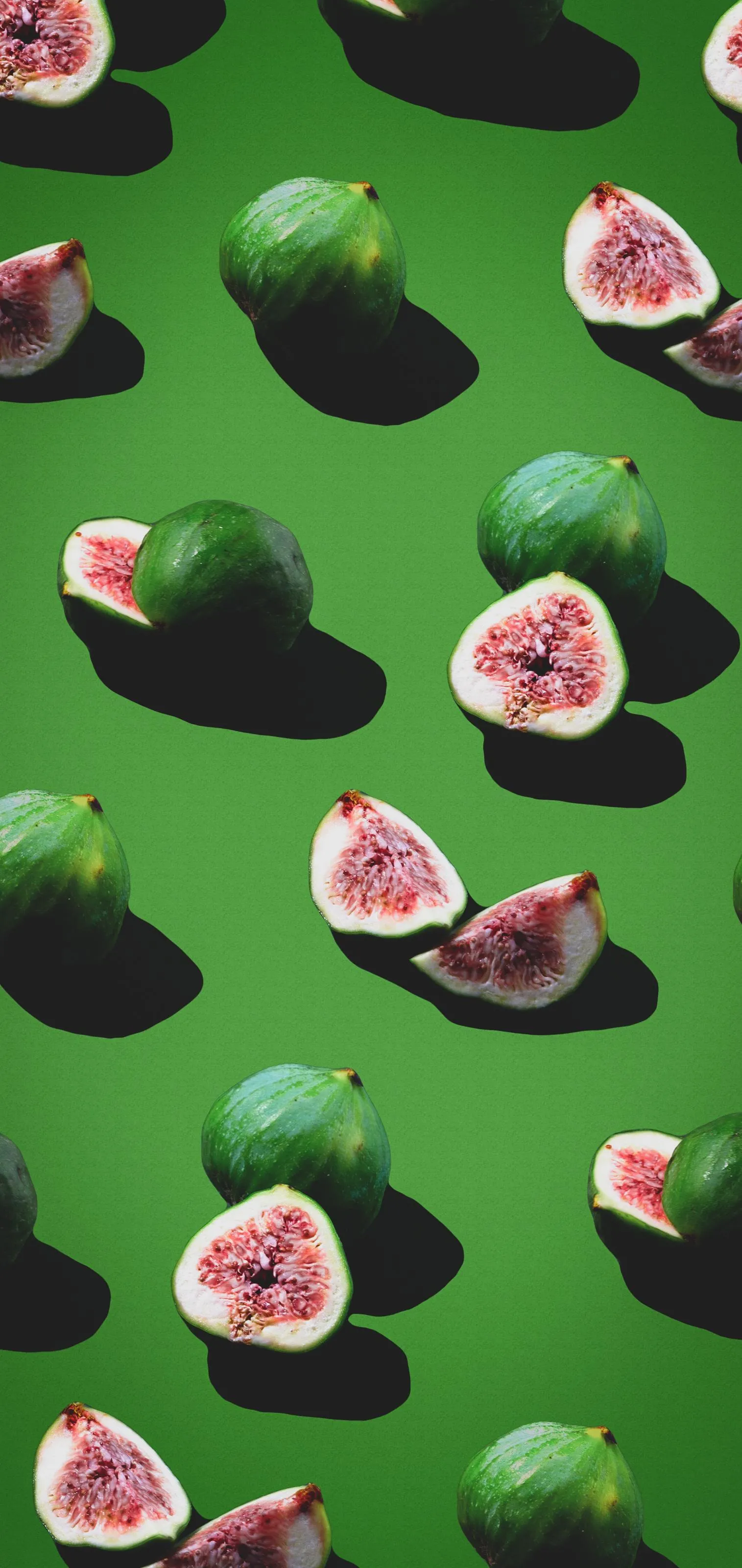 Fresh Green Figs and Juicy Halves on Bright Background