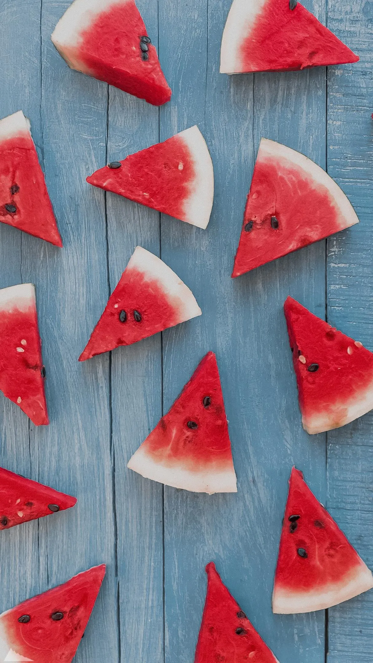 Fresh Sliced Watermelon Pattern on Blue Background Wallpaper