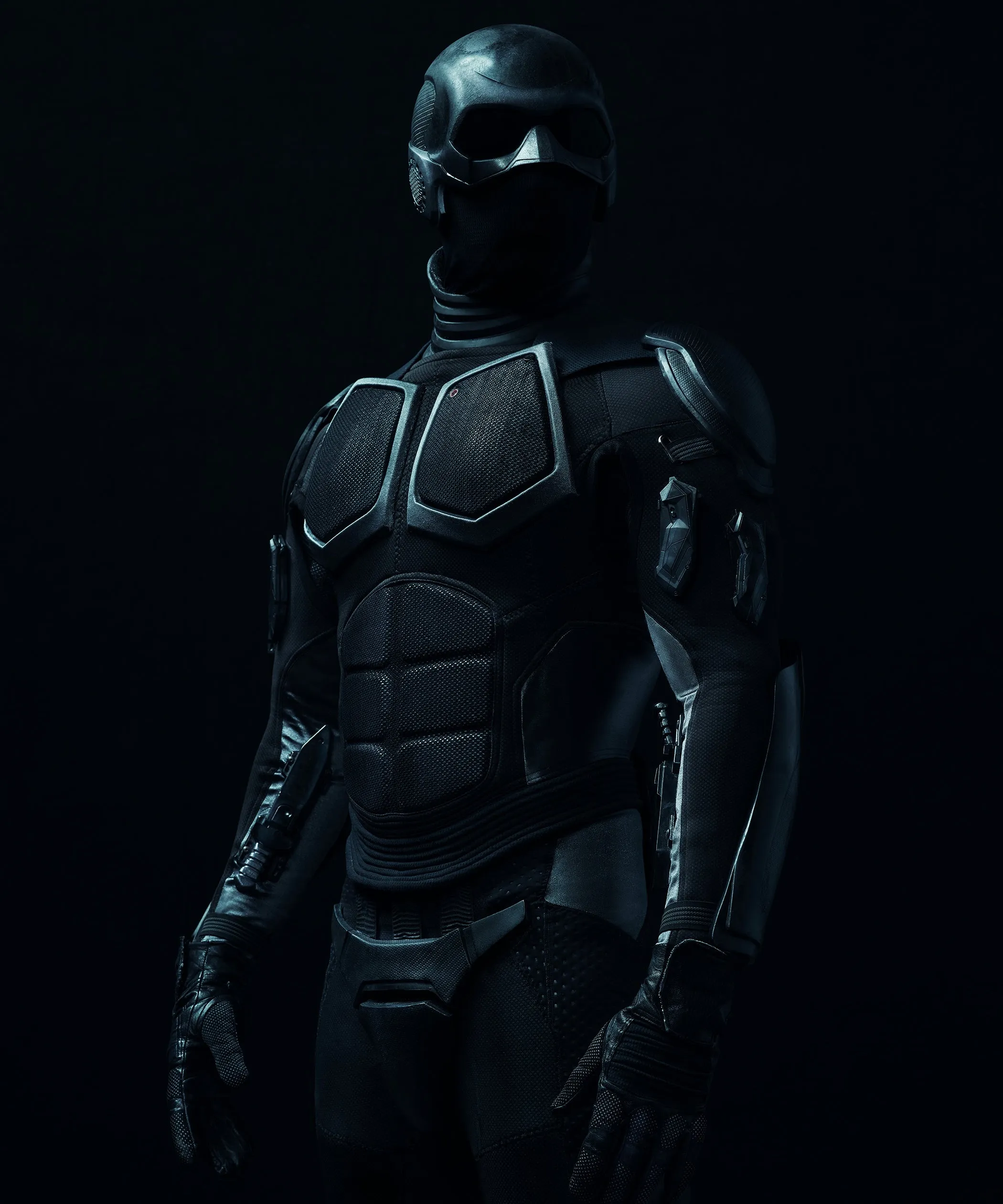 Futuristic armored soldier in a black tactical combat suit