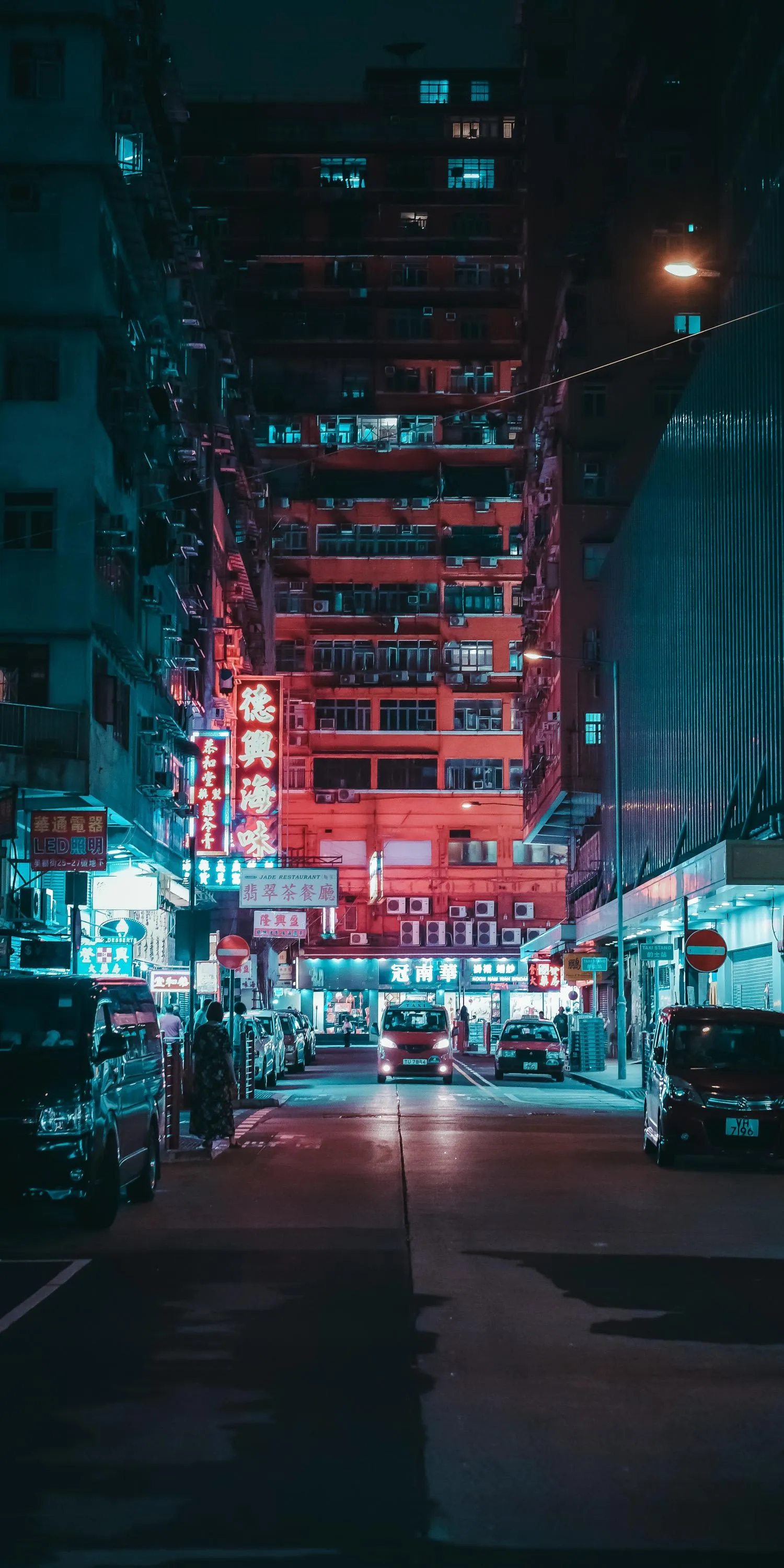 Futuristic City Street at Night with Neon Blue Lighting