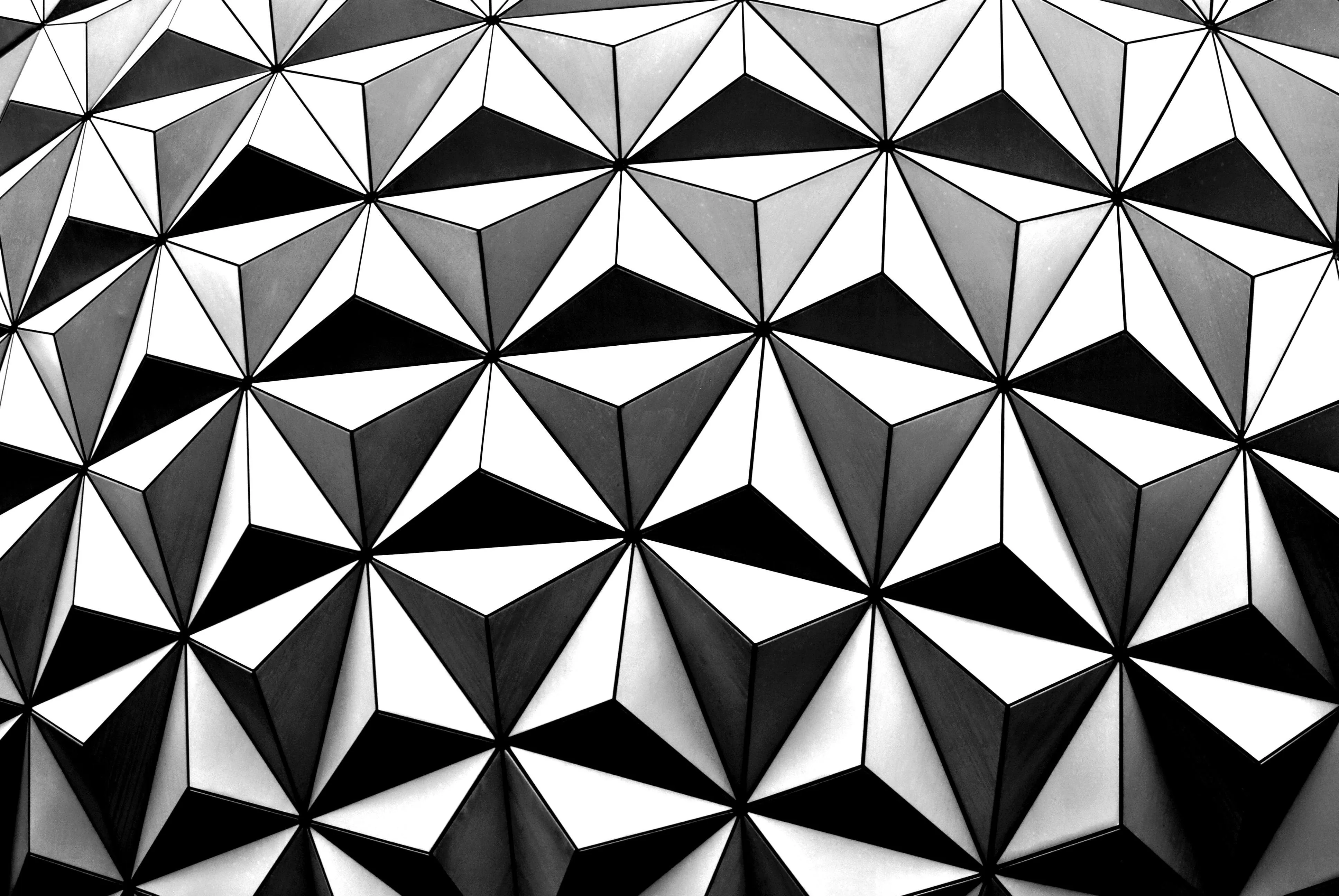 Geometric 3D silver and black triangular surface design