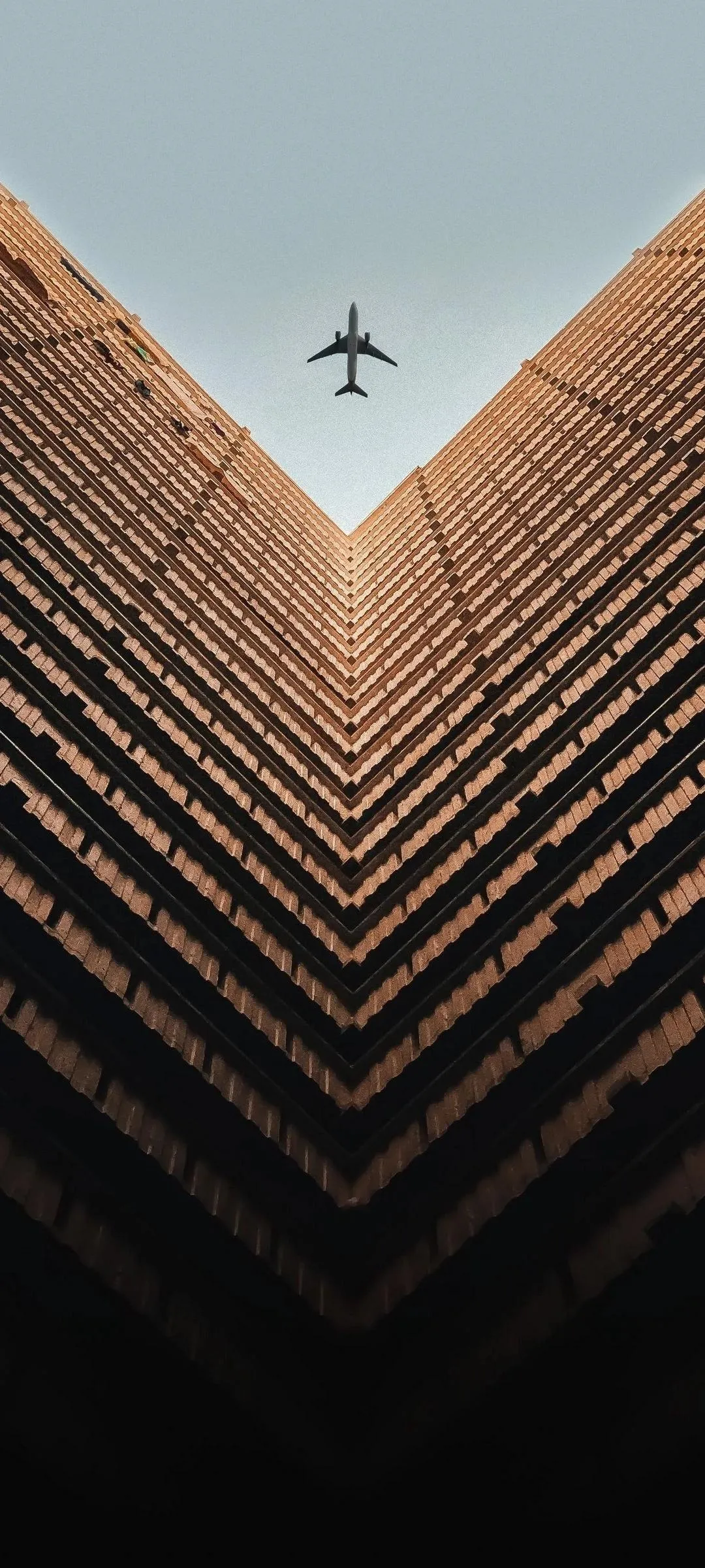 Geometric Building Symmetry with Airplane Above View