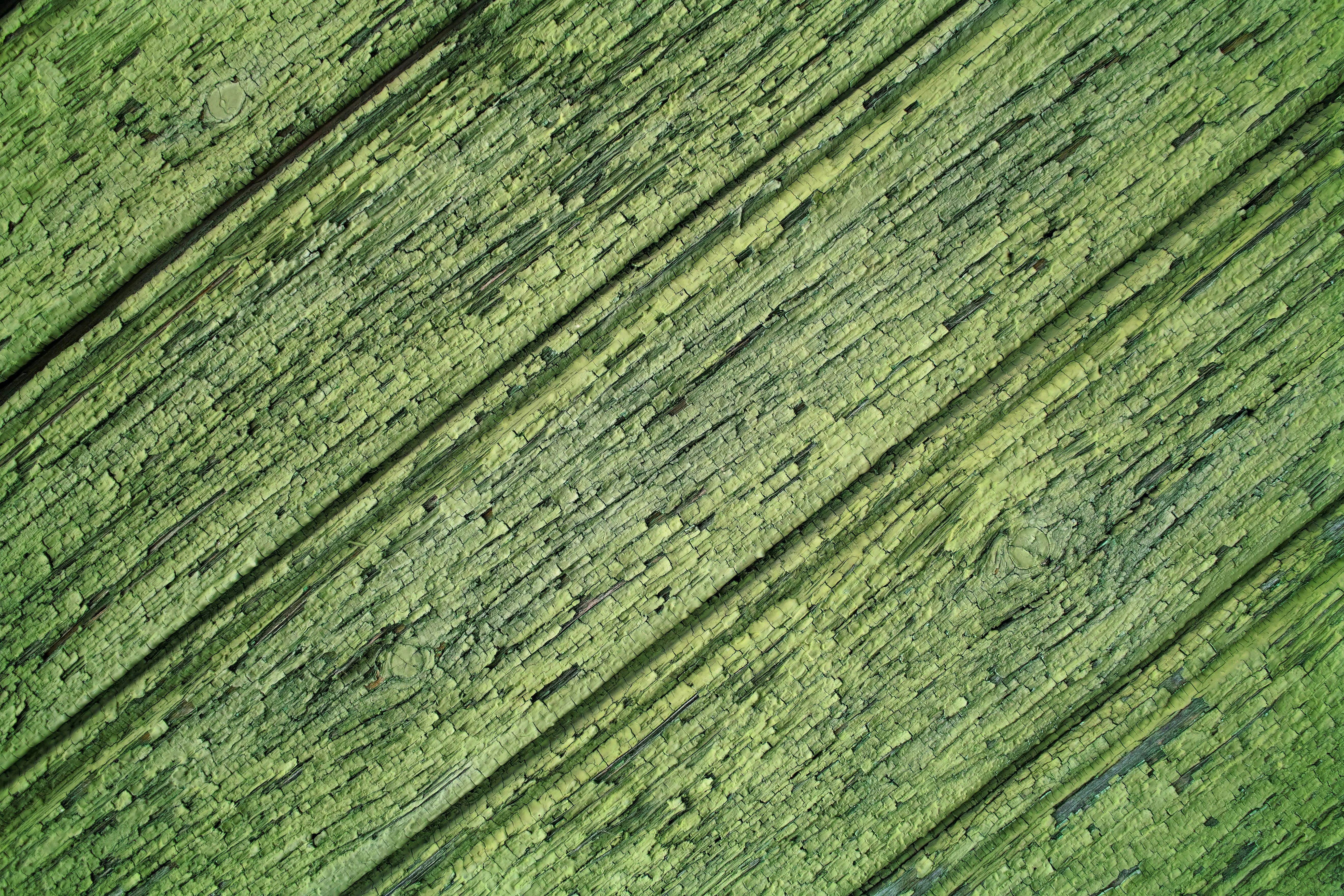 Green textured wood background with diagonal lines Wallpaper