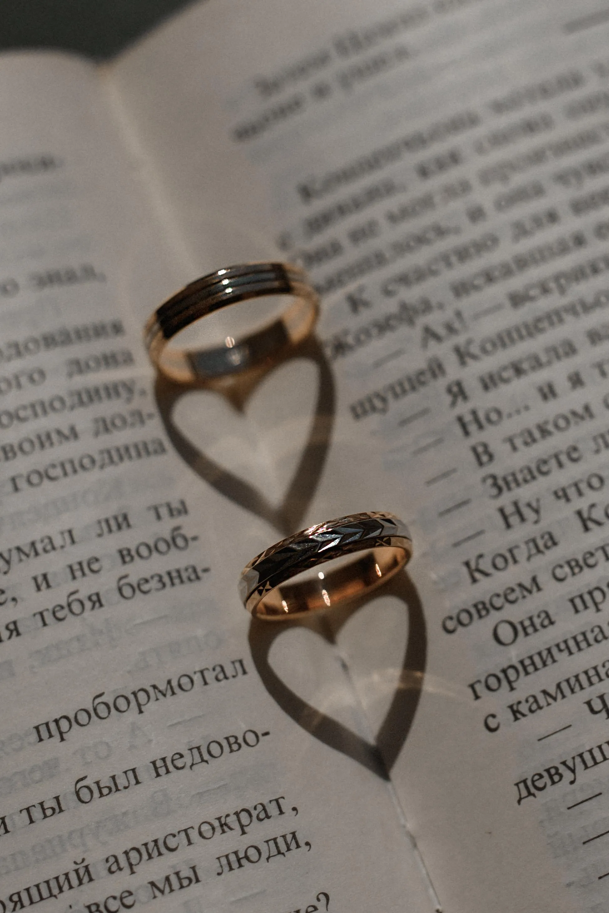 Heart Shaped Rings on Book Page for Love Quote Background