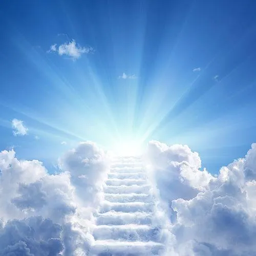 Heavenly light sky with sun rays shining through clouds