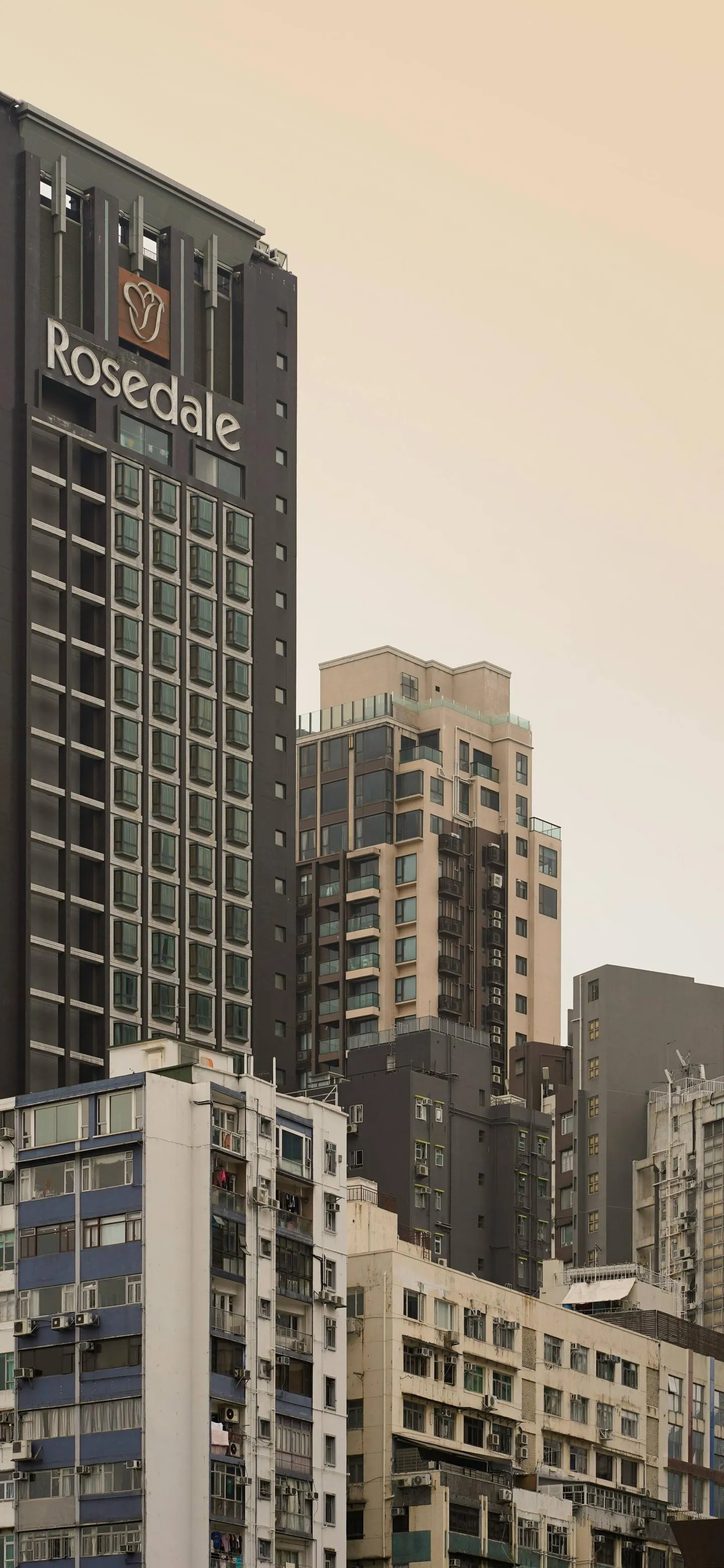 High Rise Cityscape in Soft Beige Morning Light Wallpaper