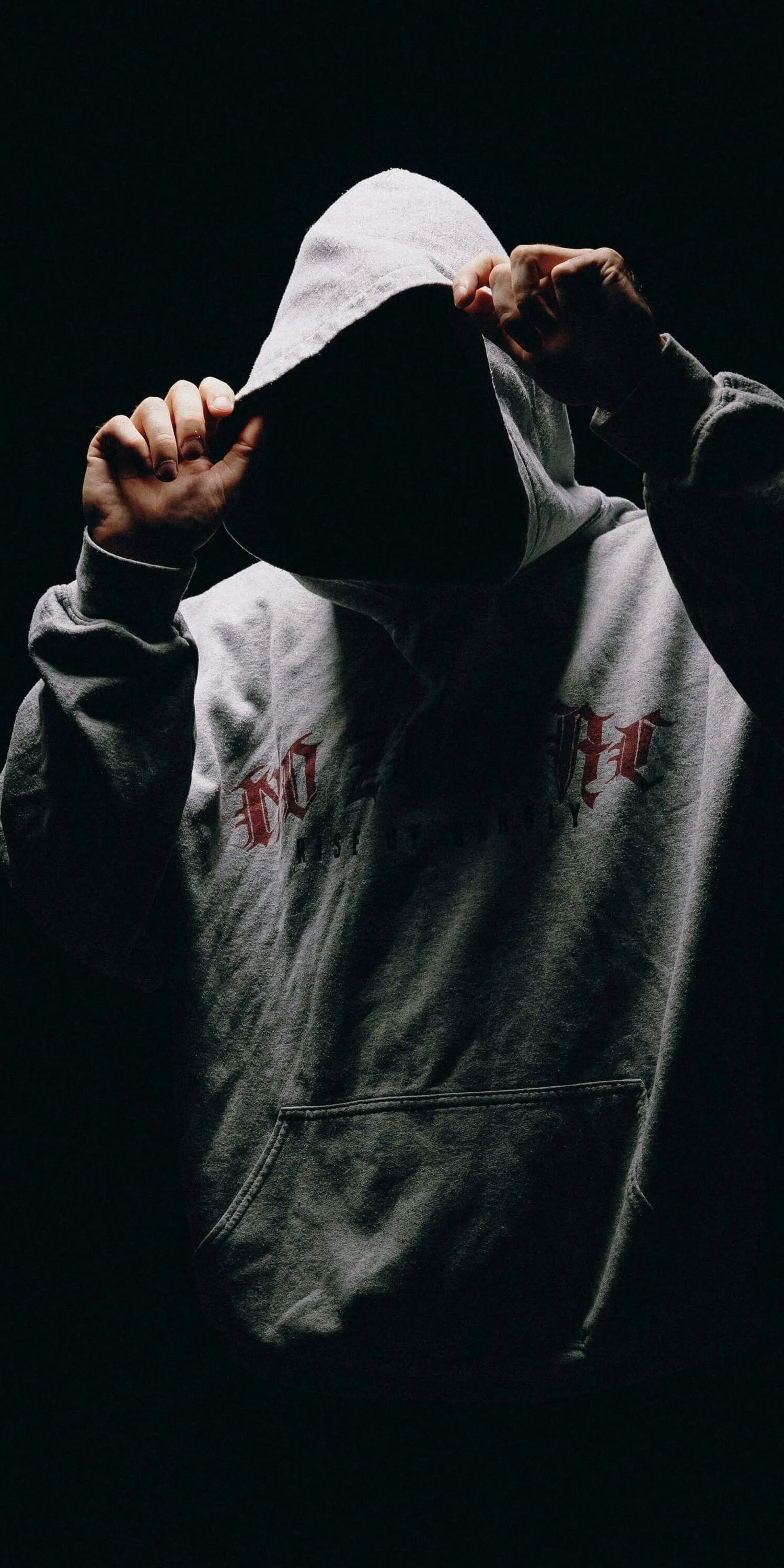 Hooded Figure Standing in the Dark Mysterious Wallpaper