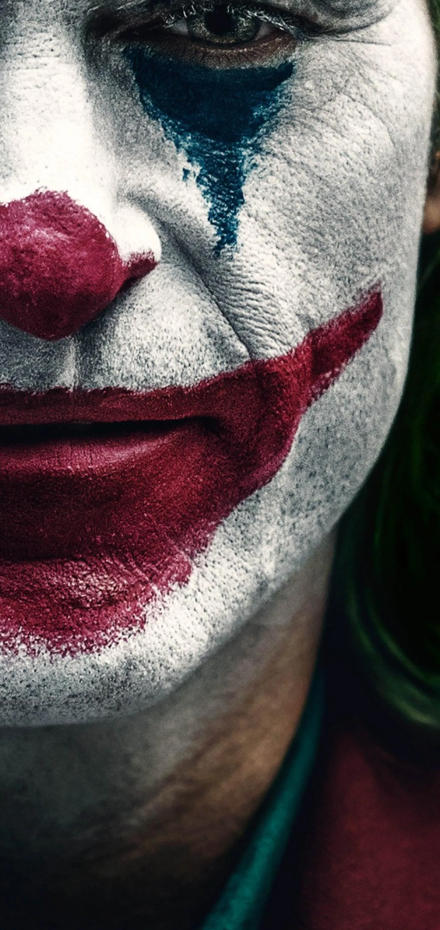 Joker Face in Dark Background with Intense Painted Expression