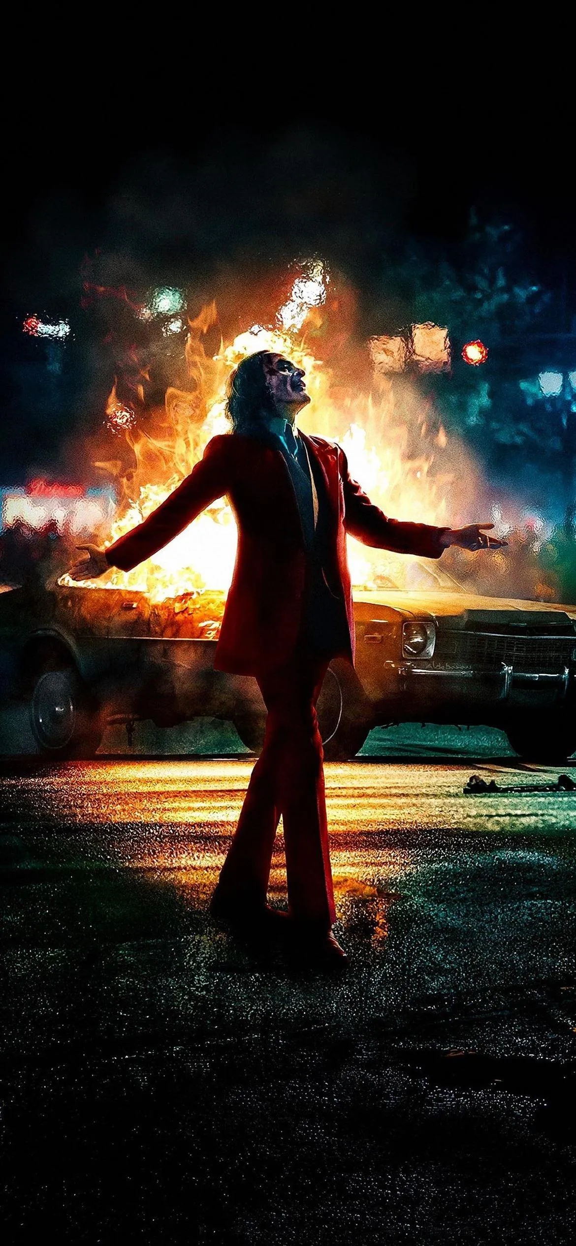 Joker Figure Standing with Fiery Background Wallpaper