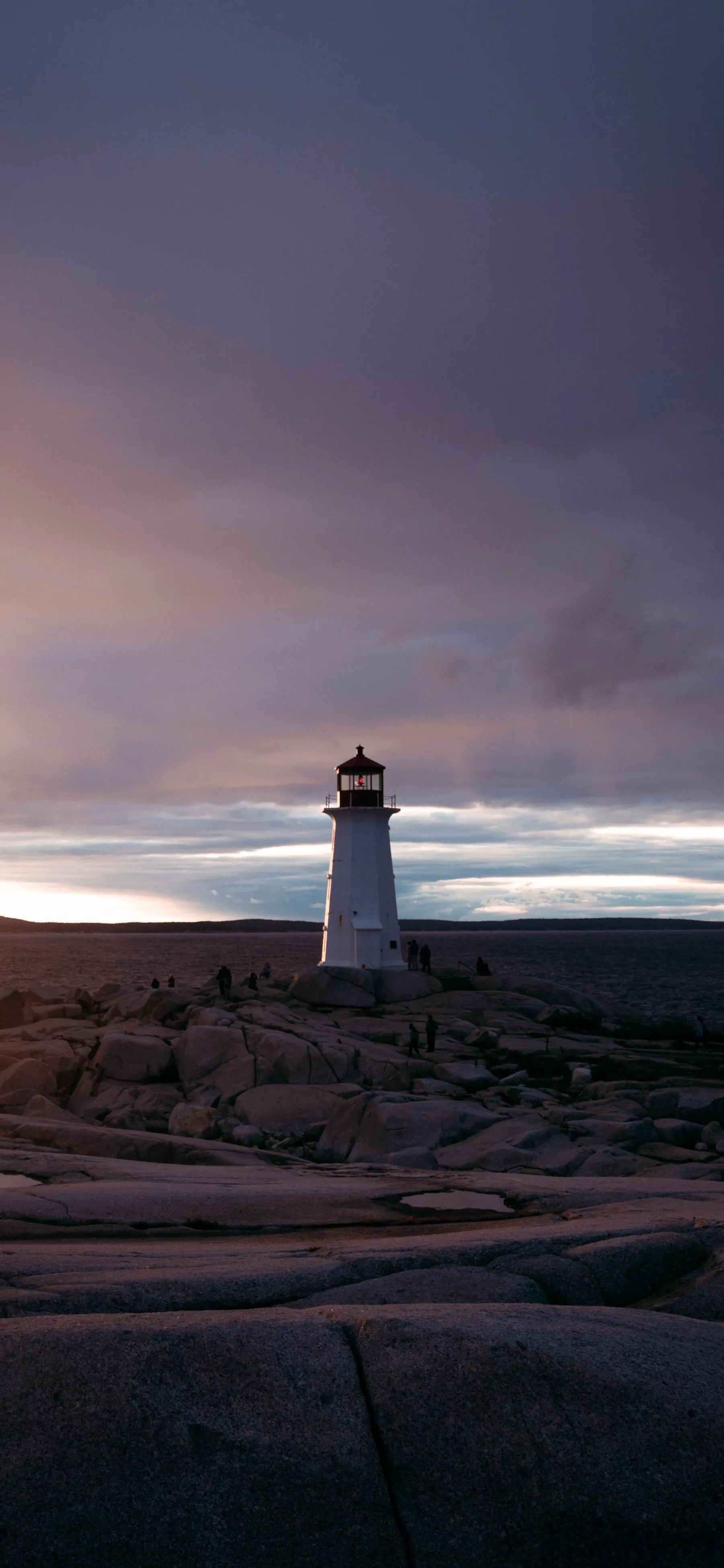 Lighthouse at Sunset with Soft Ocean Horizon View Wallpaper