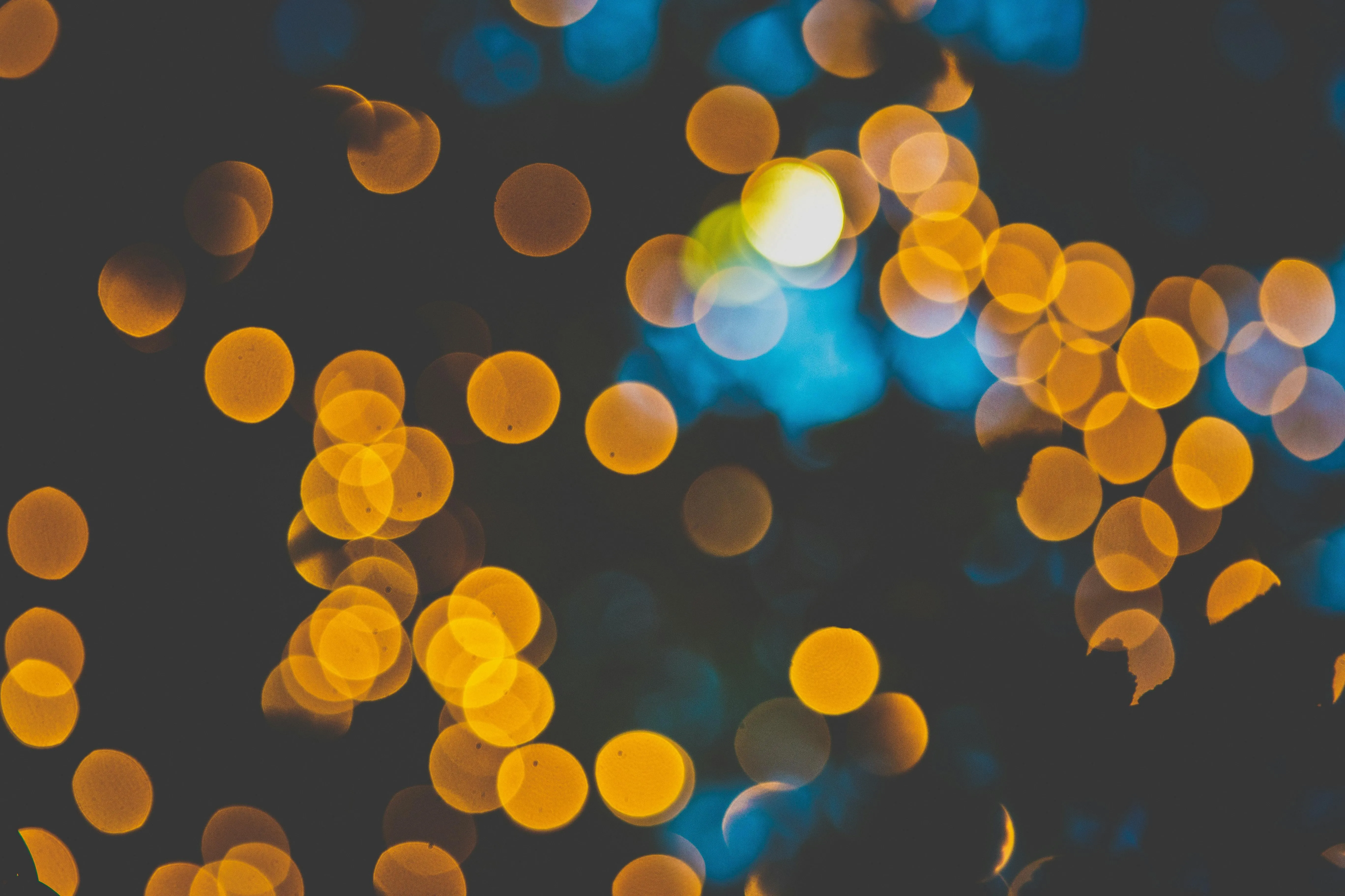 Lights glowing in orange and blue against a dark background