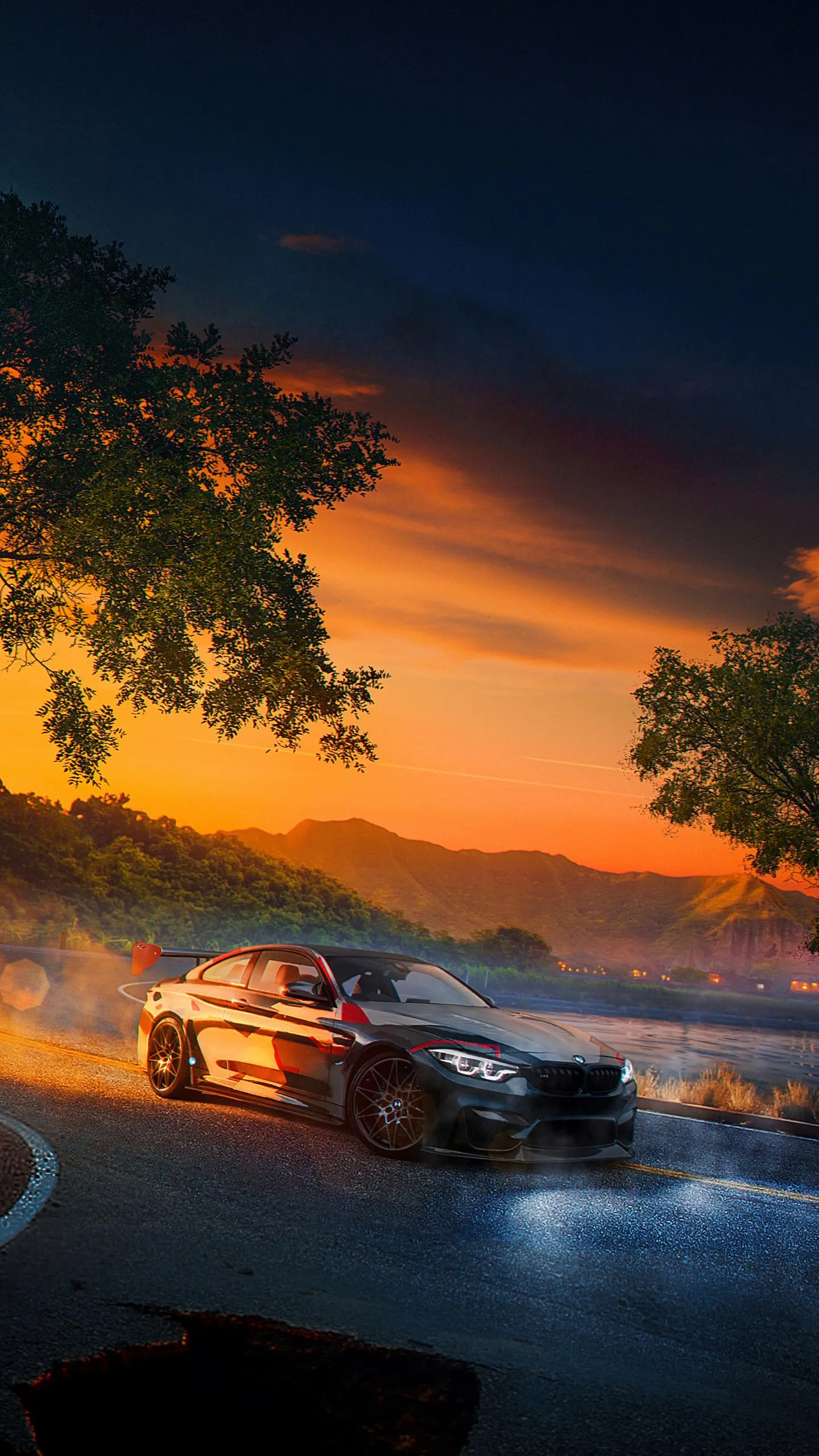 Luxury Sports Car Racing Through Fiery Sunset Road Wallpaper