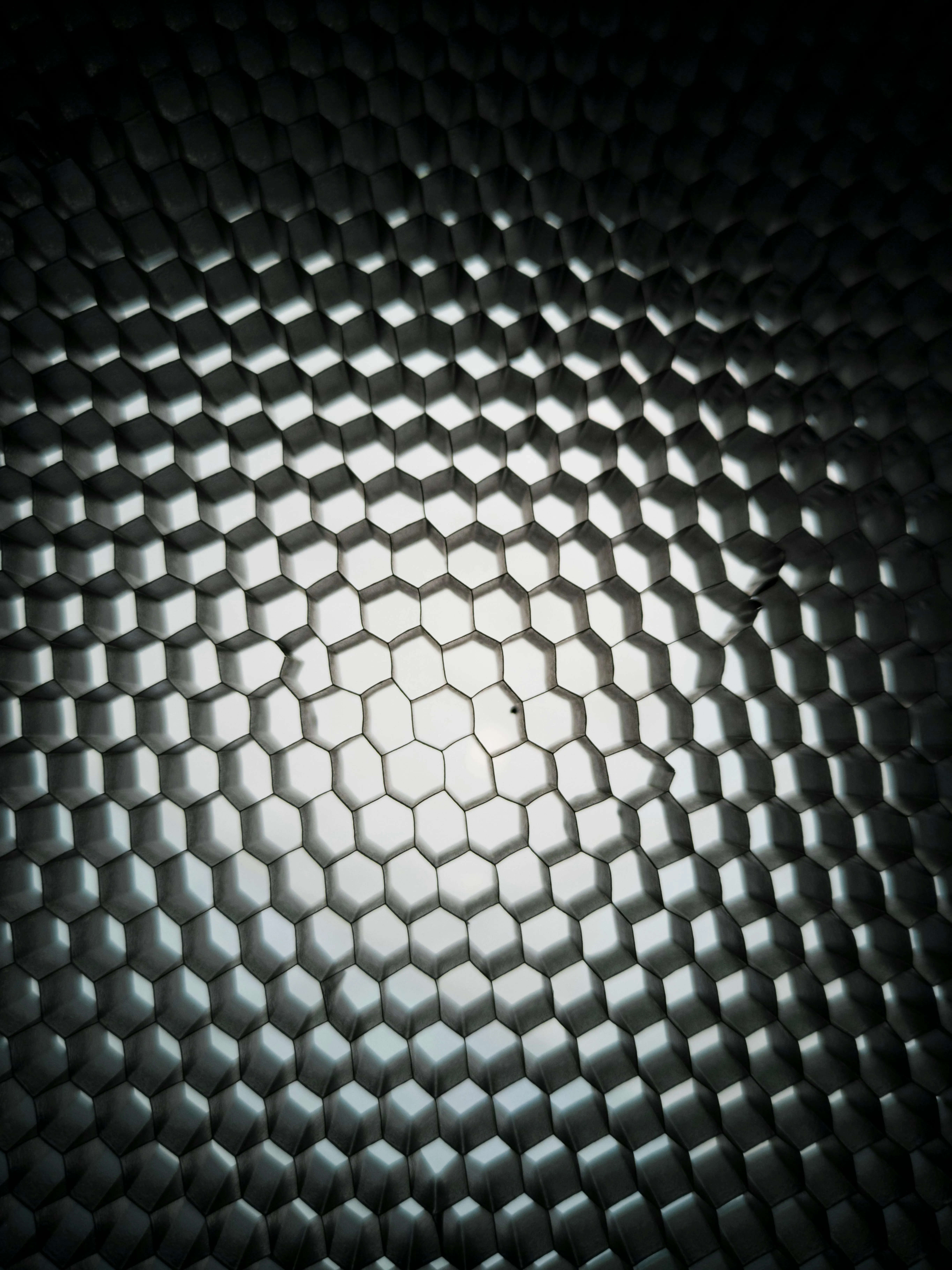 Metallic honeycomb pattern with light reflection Wallpaper