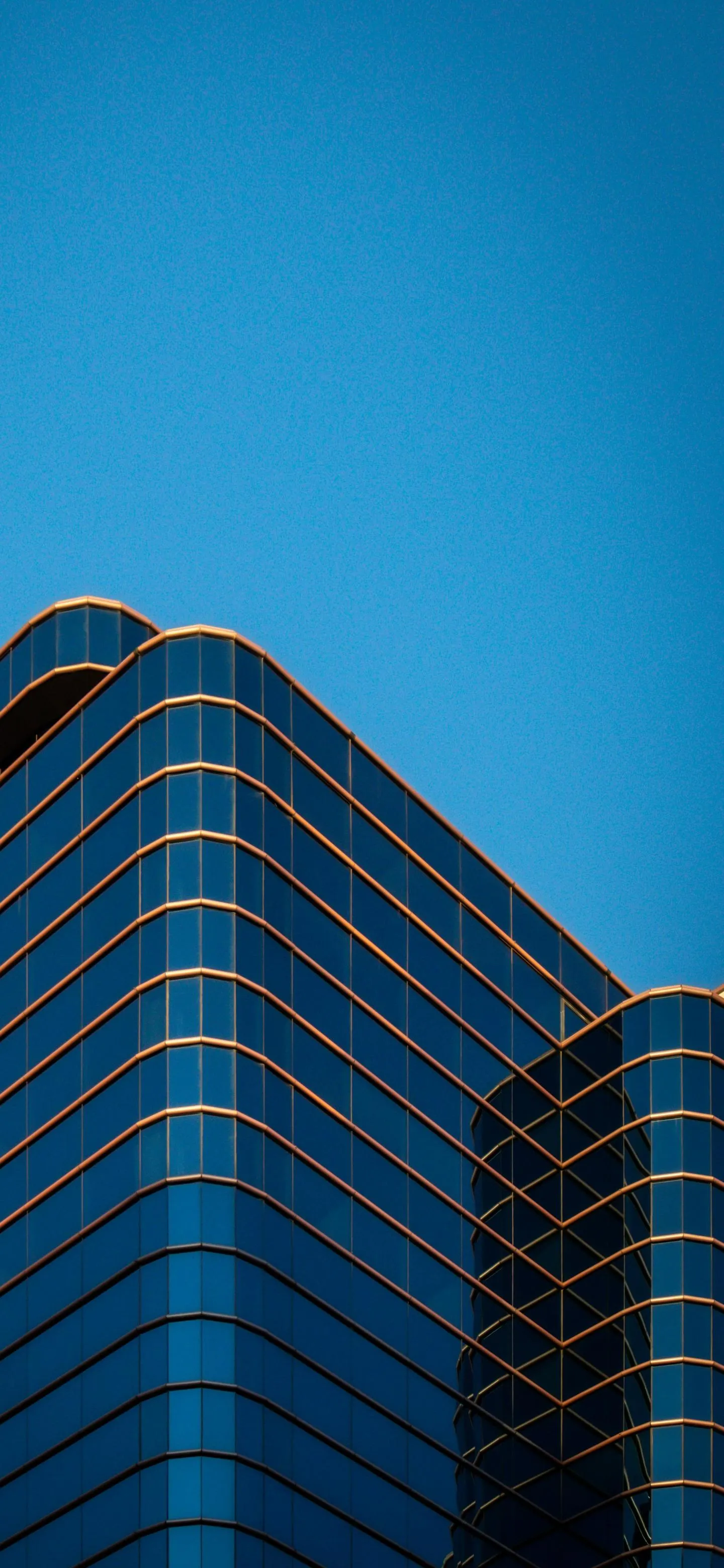 Modern Office Building with Clear Blue Sky Backdrop