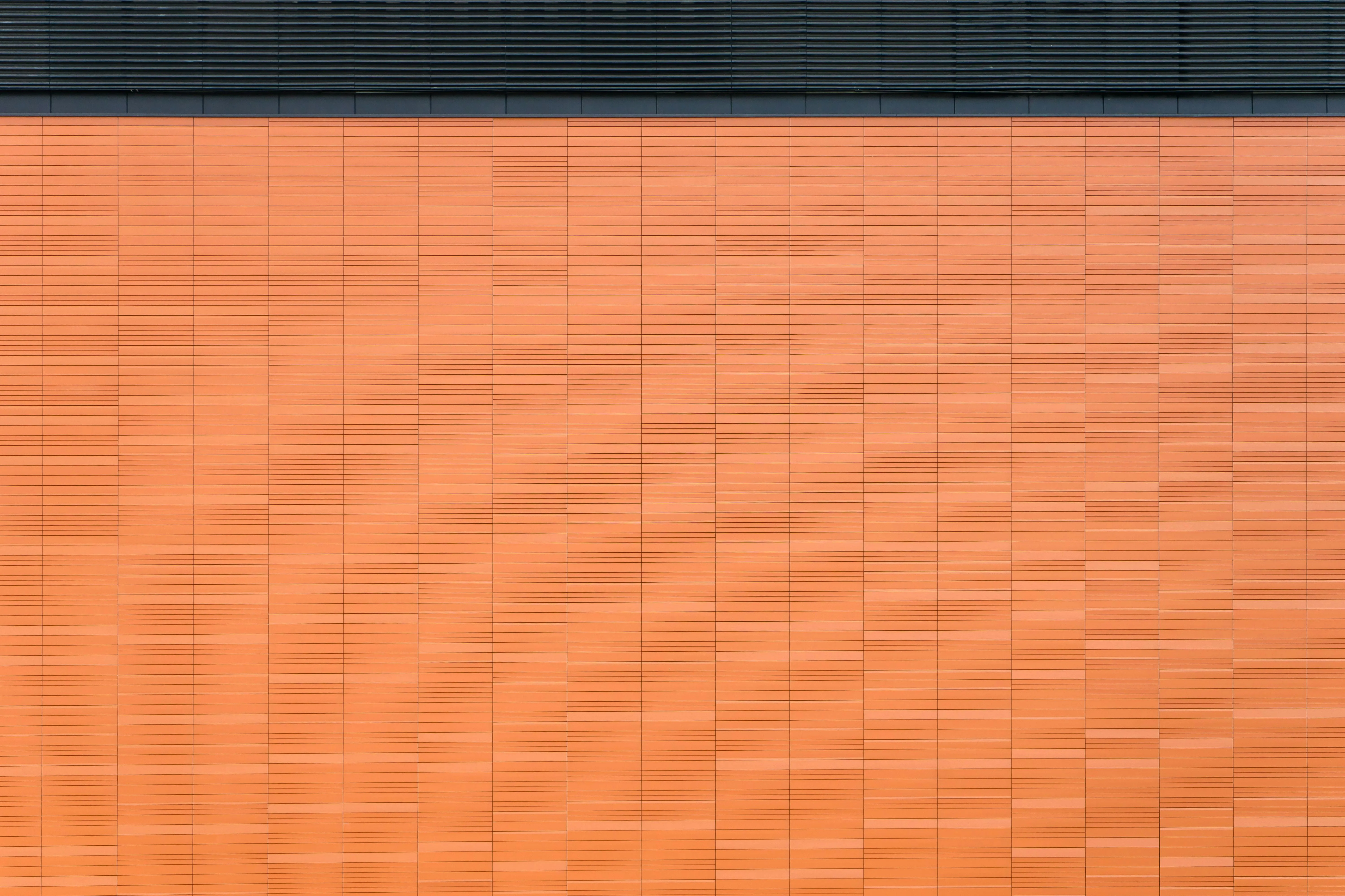 Modern orange bamboo textured wall background Wallpaper