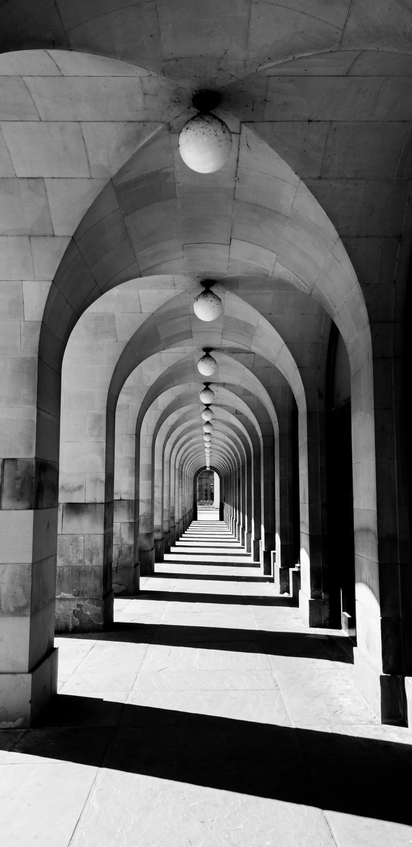 Monochrome Corridor with Arches in Symmetrical Frame