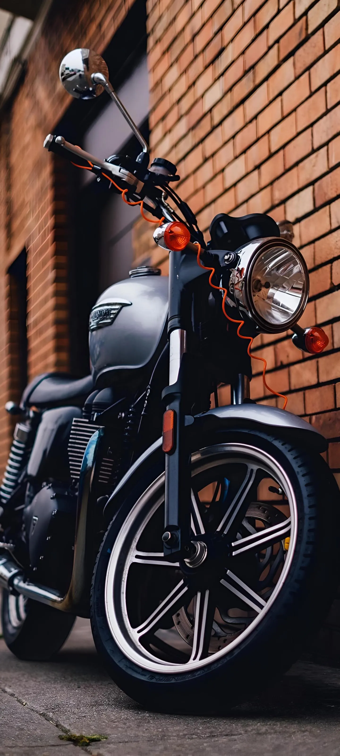Motorcycle Parked with Rider Standing Near at Sunset