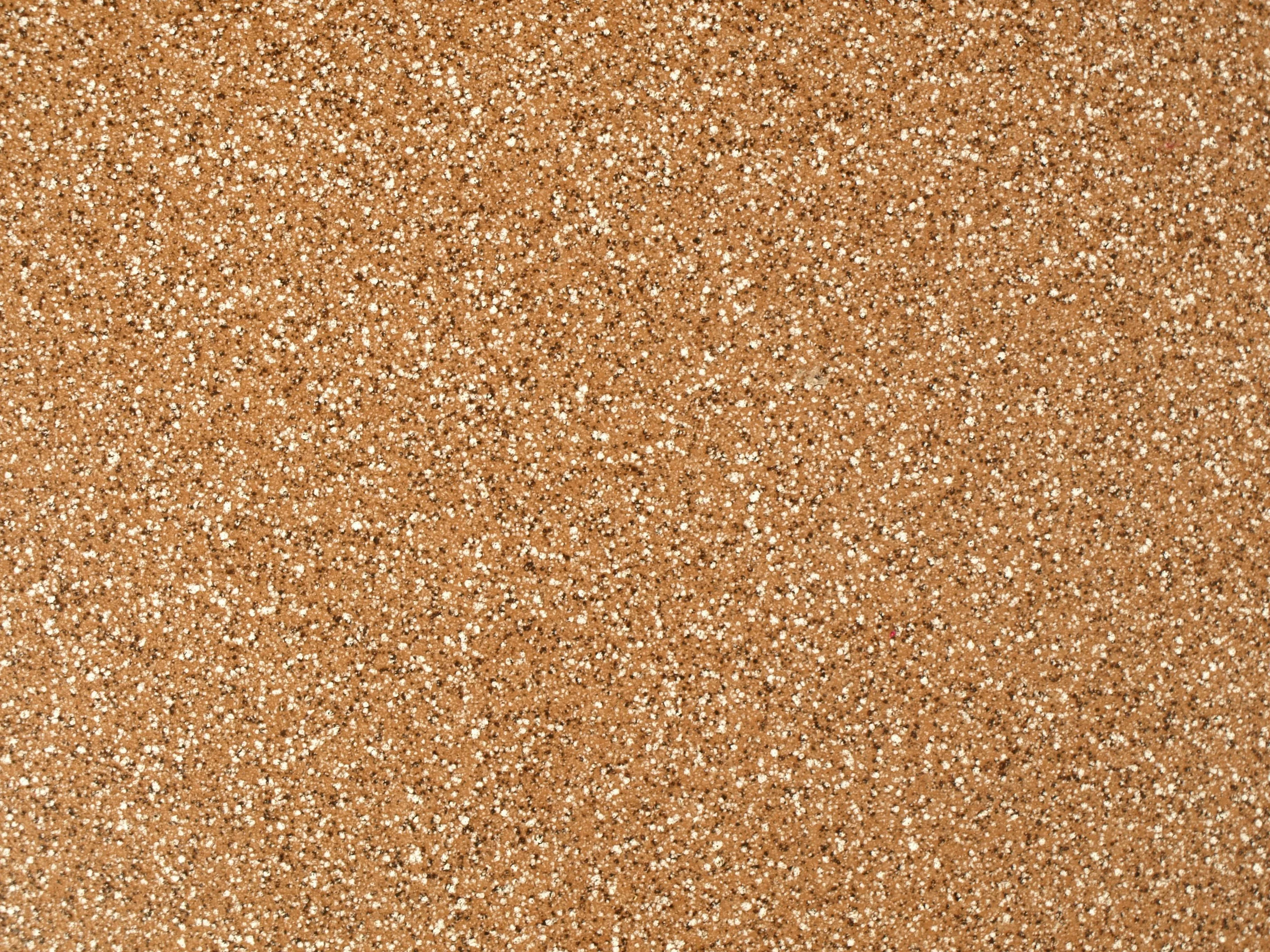 Natural corkboard texture background with small white flecks