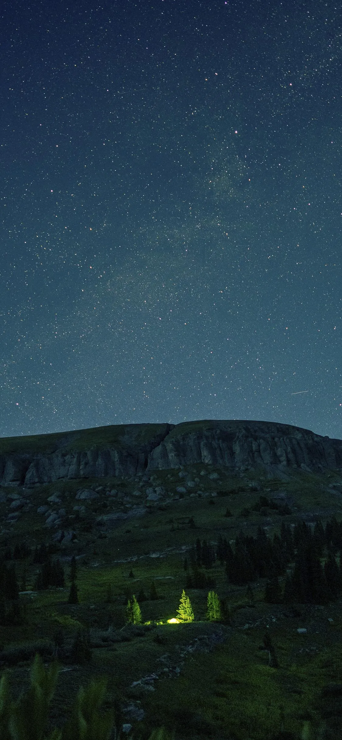 Night Sky Full of Stars over Dark Mountain Landscape