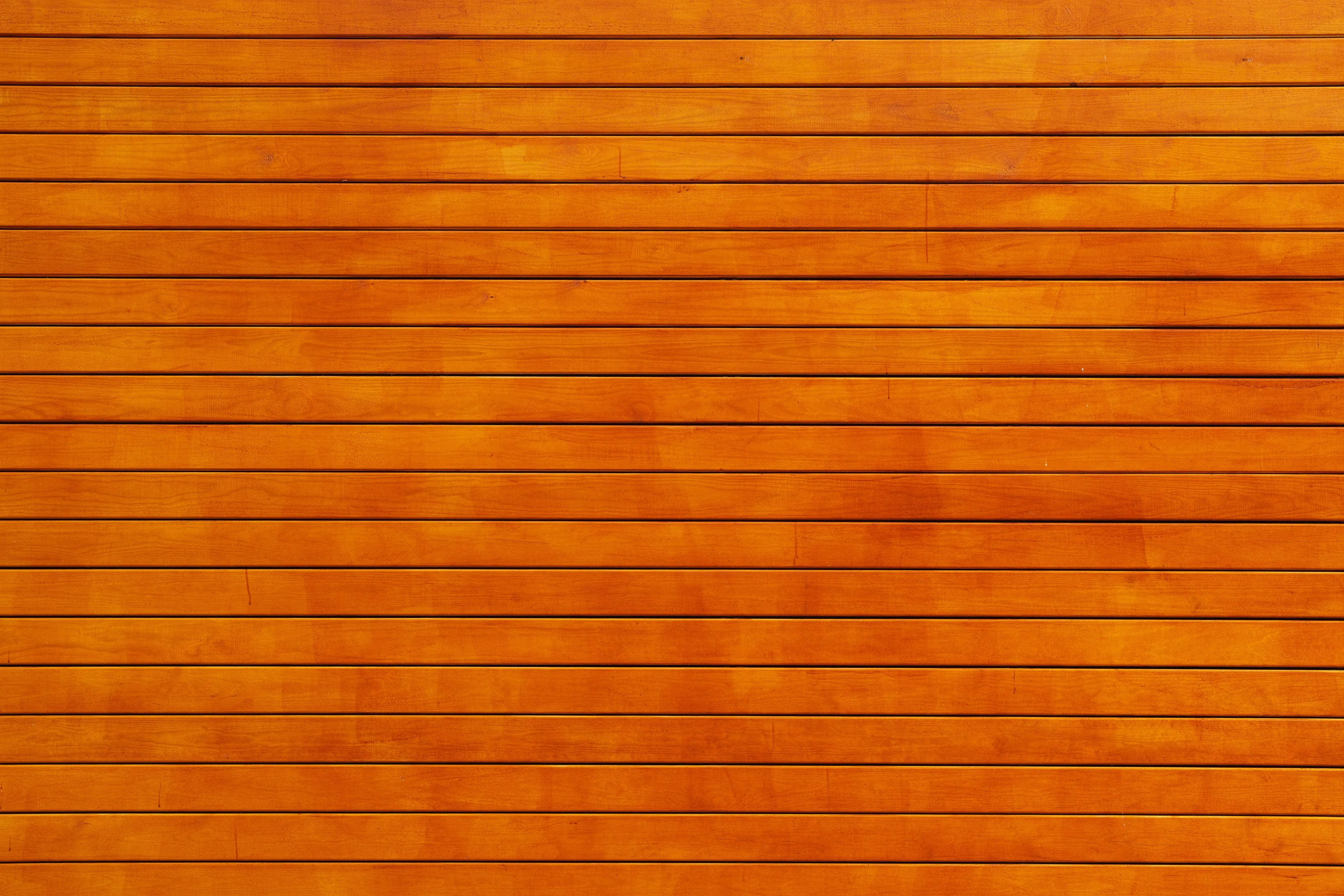 Orange wooden wall with horizontal panel free Wallpaper
