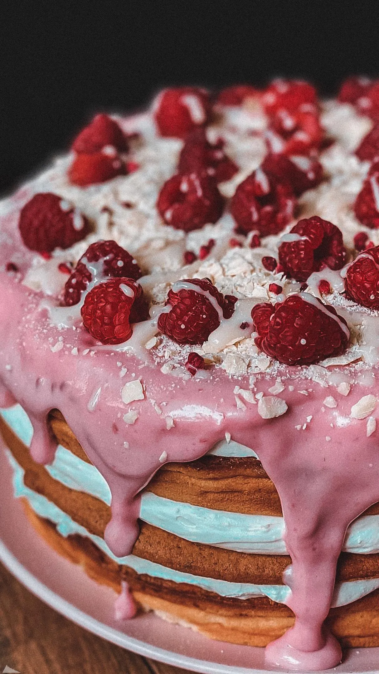 Pancakes with Cream and Strawberries Stacked on Plate