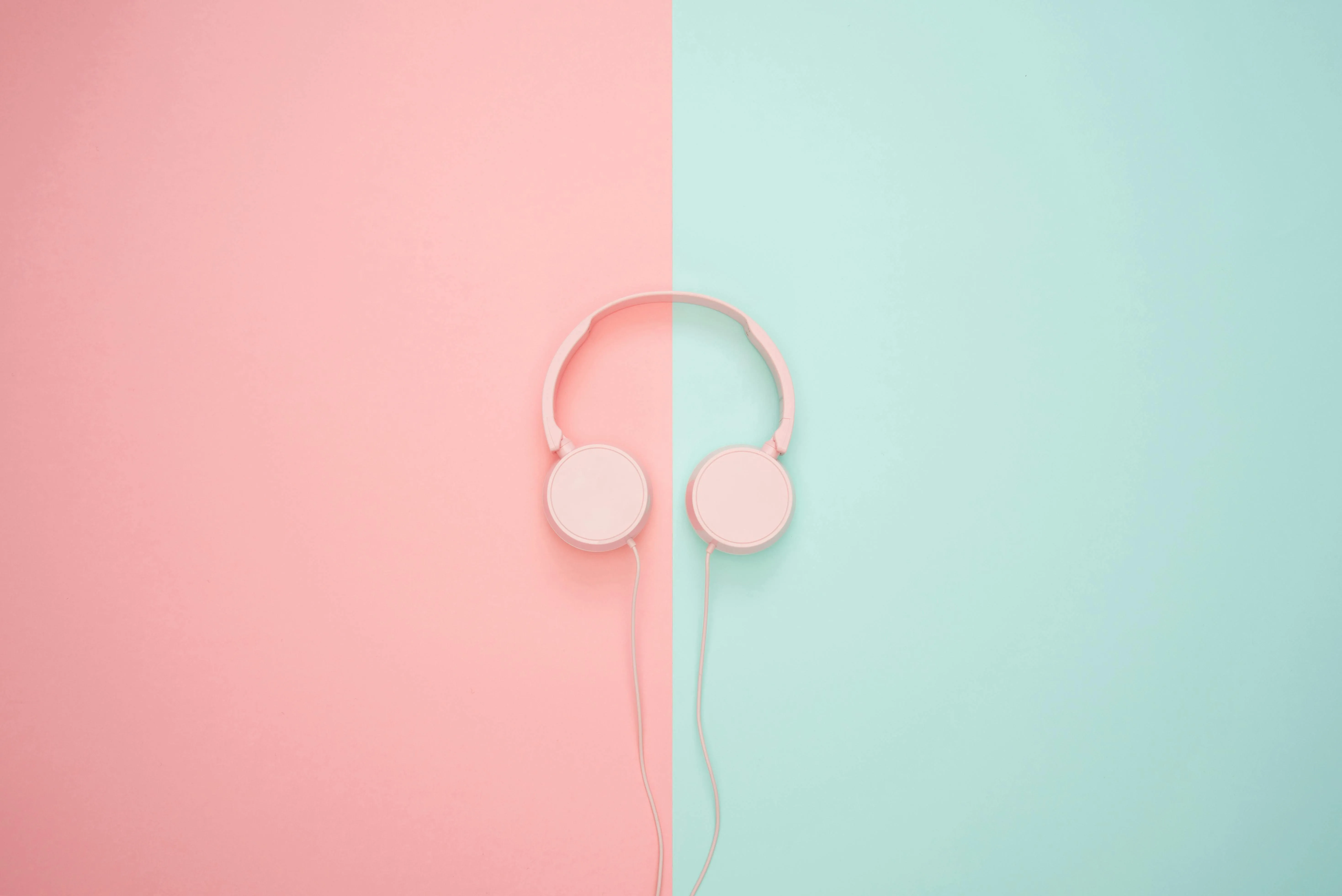 Pastel pink and blue background with headphones Wallpaper