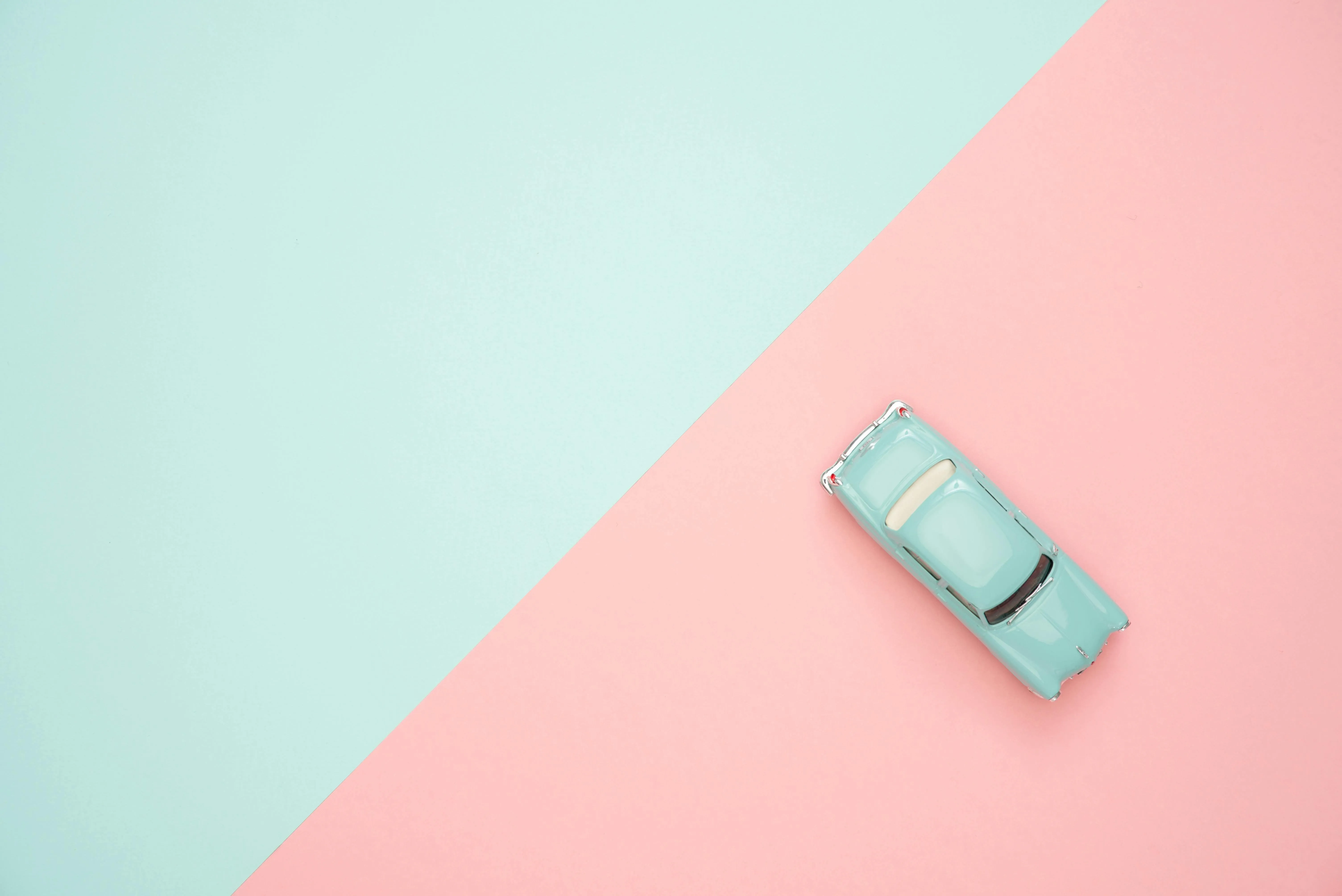 Pastel pink and mint green diagonal split colour background