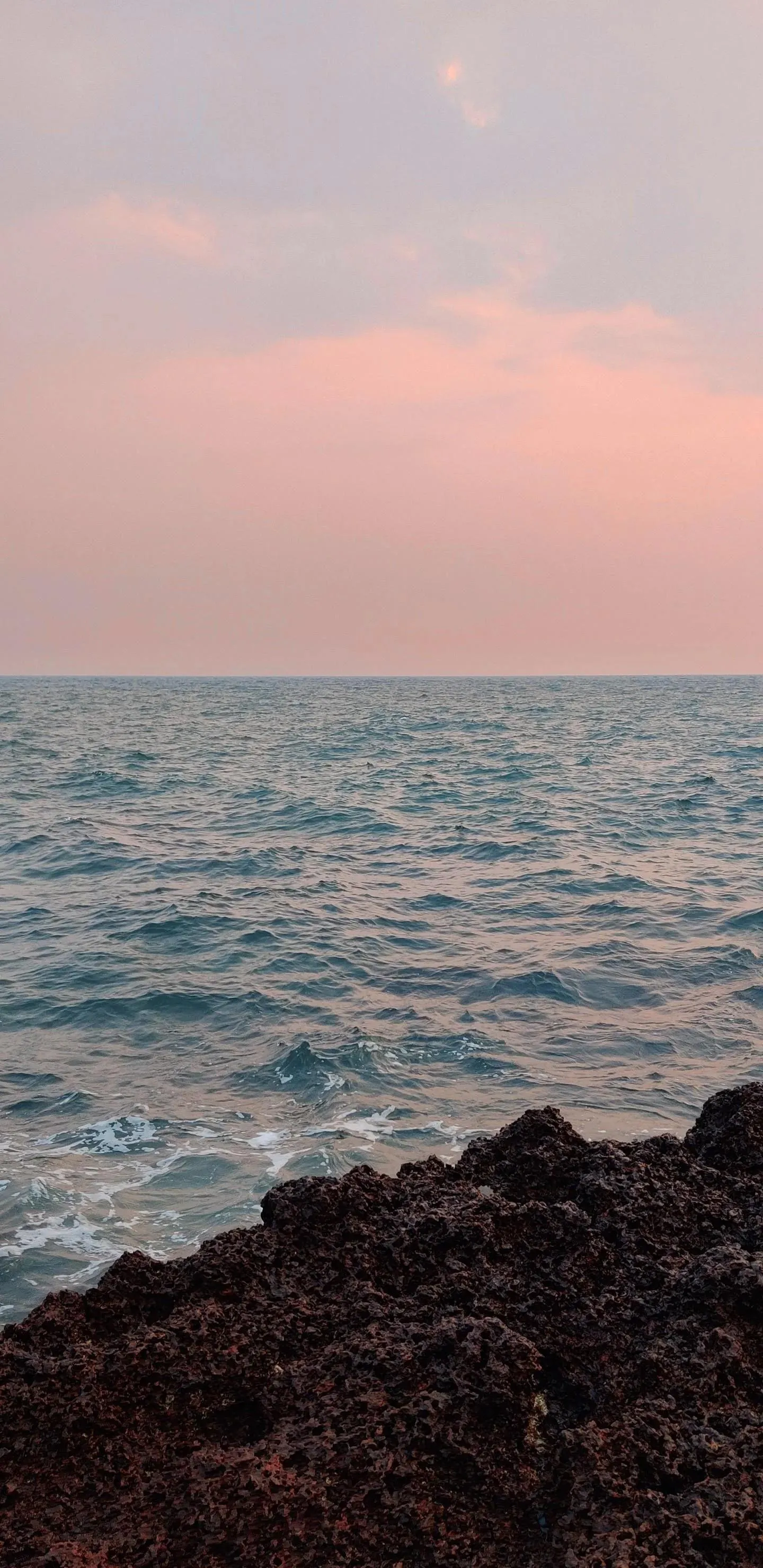 Peaceful Ocean Sunset with Orange and Pink Sky Tones