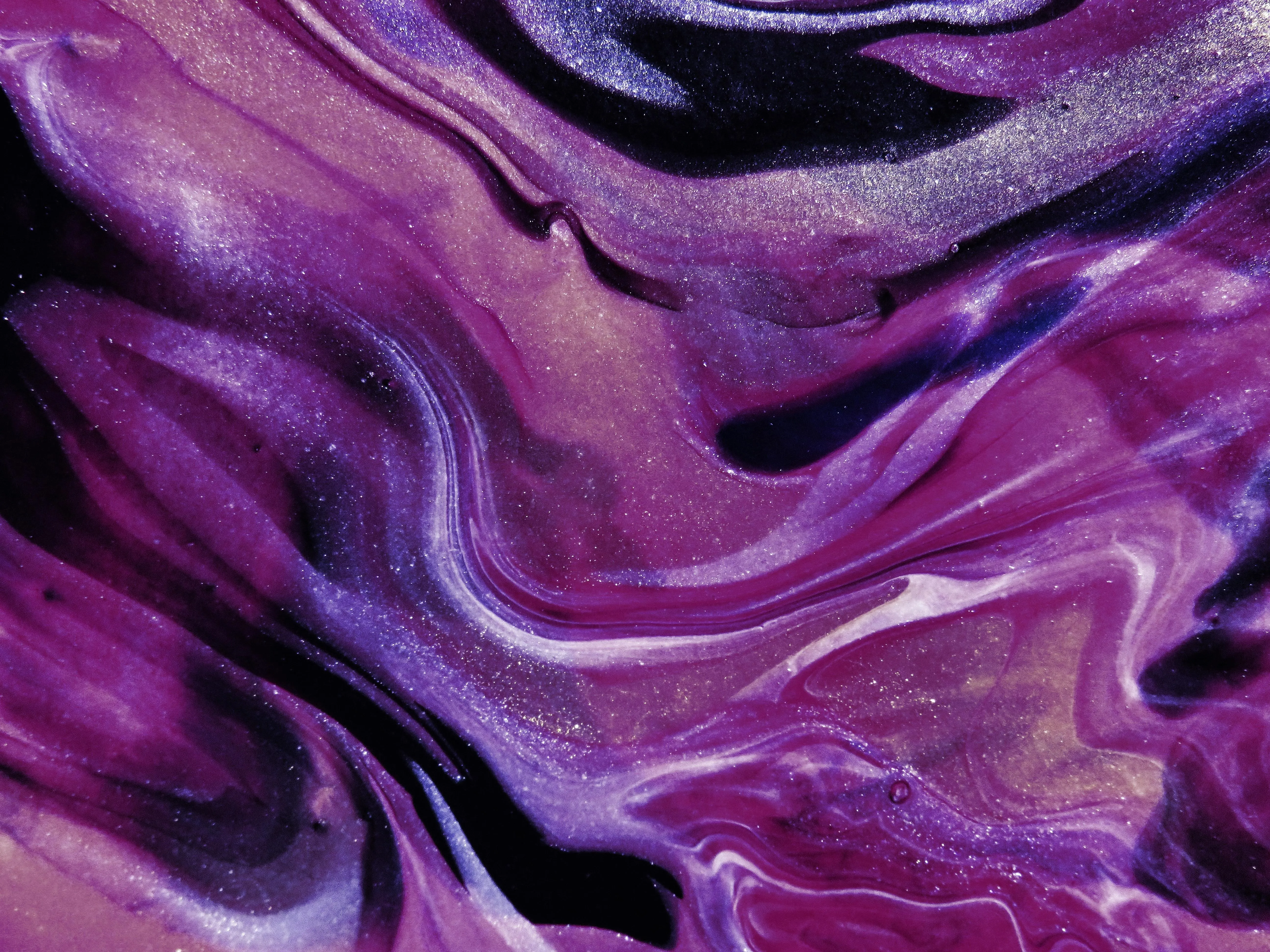Purple and black marbled abstract paint texture Wallpaper