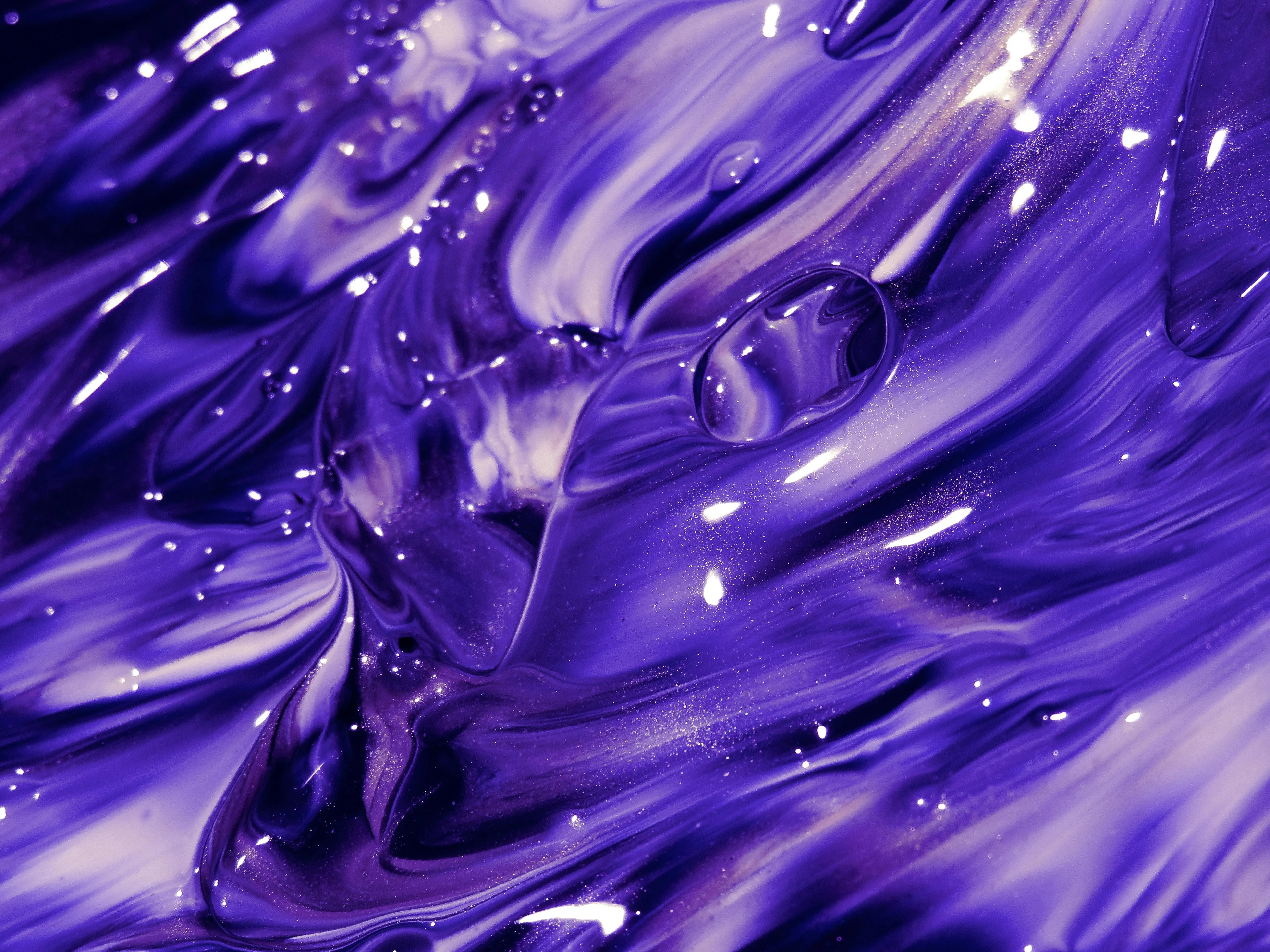 Purple paint swirl with glossy texture and highlights image