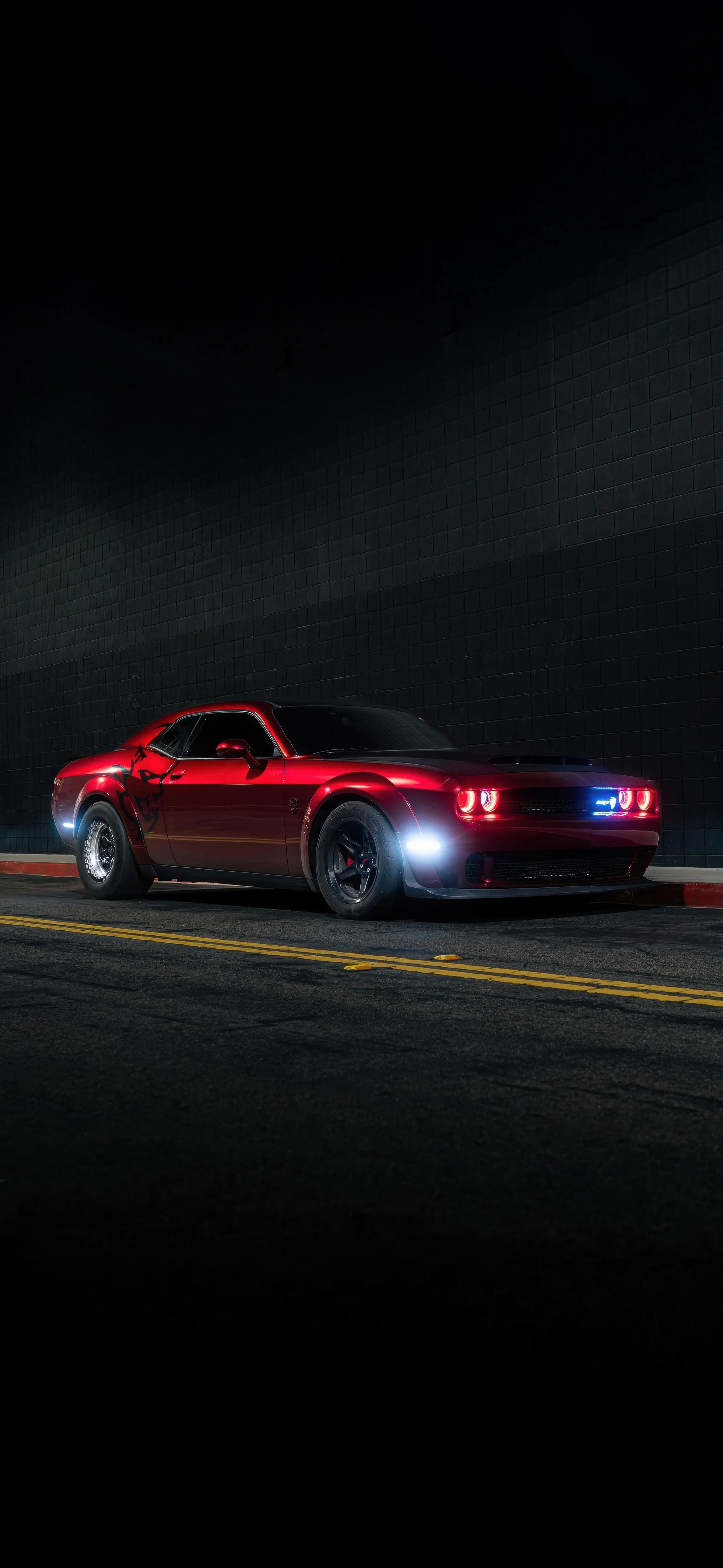 Red Sports Car Driving on Dark Road At Night Wallpaper