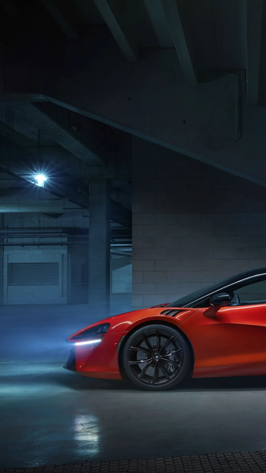 Red Sports Car in Dimly Lit Garage Setting Wallpaper