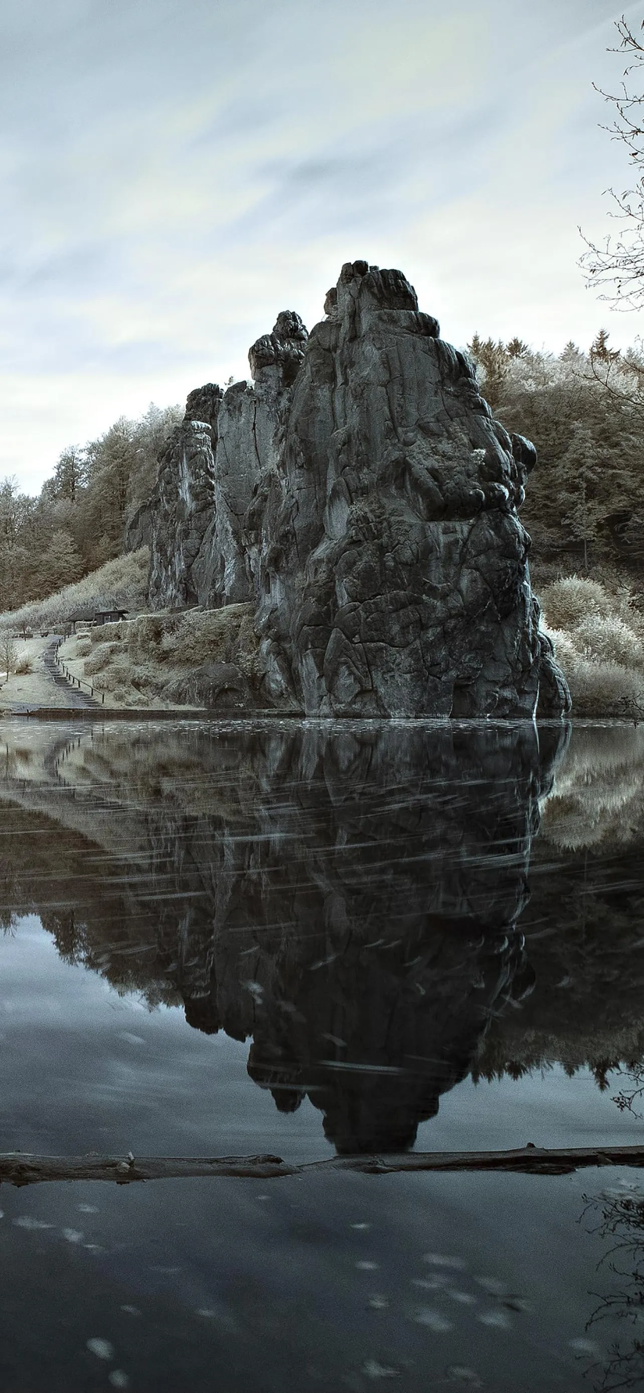 Rocky Mountains Reflected in Calm Lake Water Wallpaper