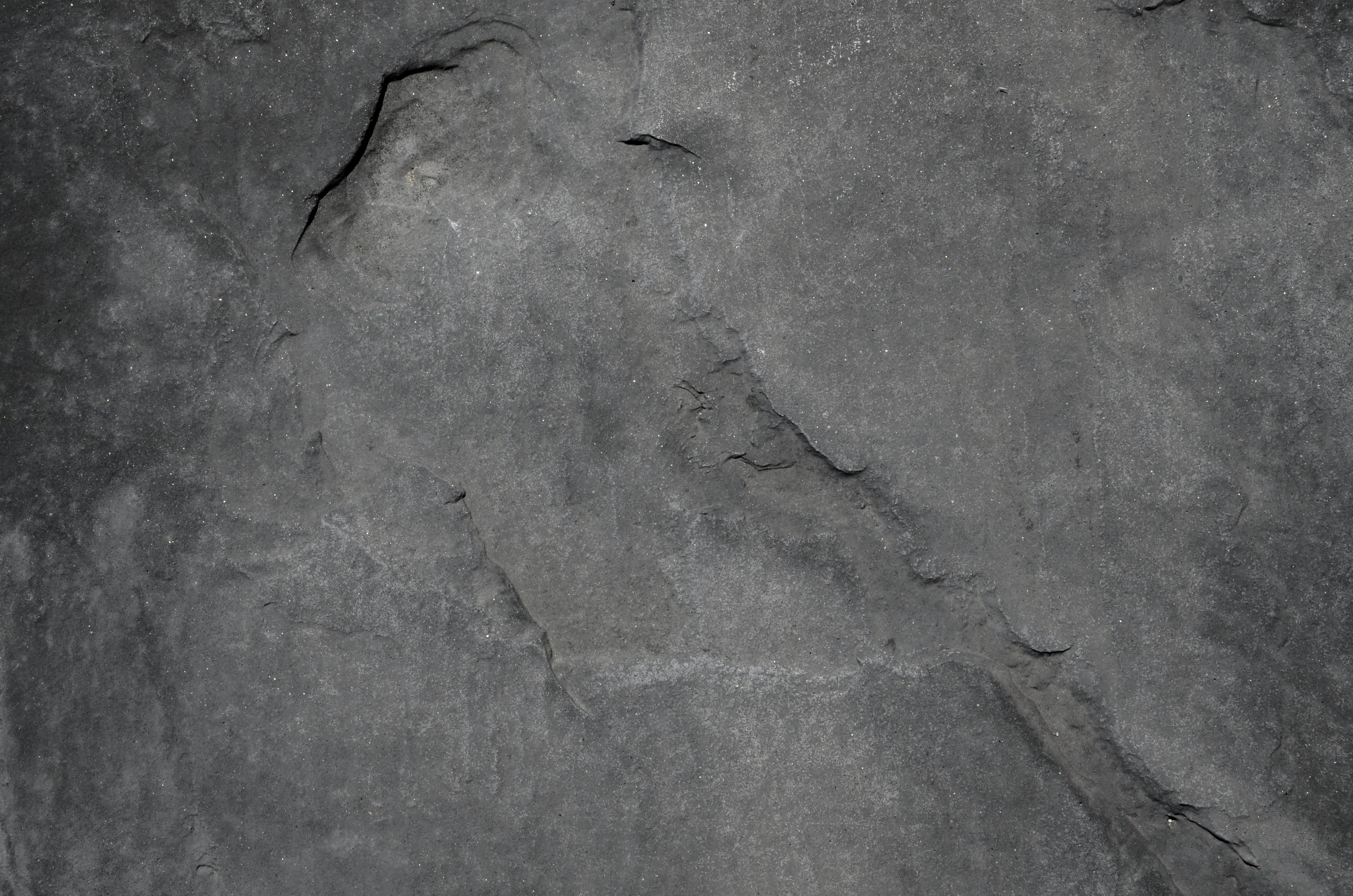 Rough gray stone texture with cracks and details Background