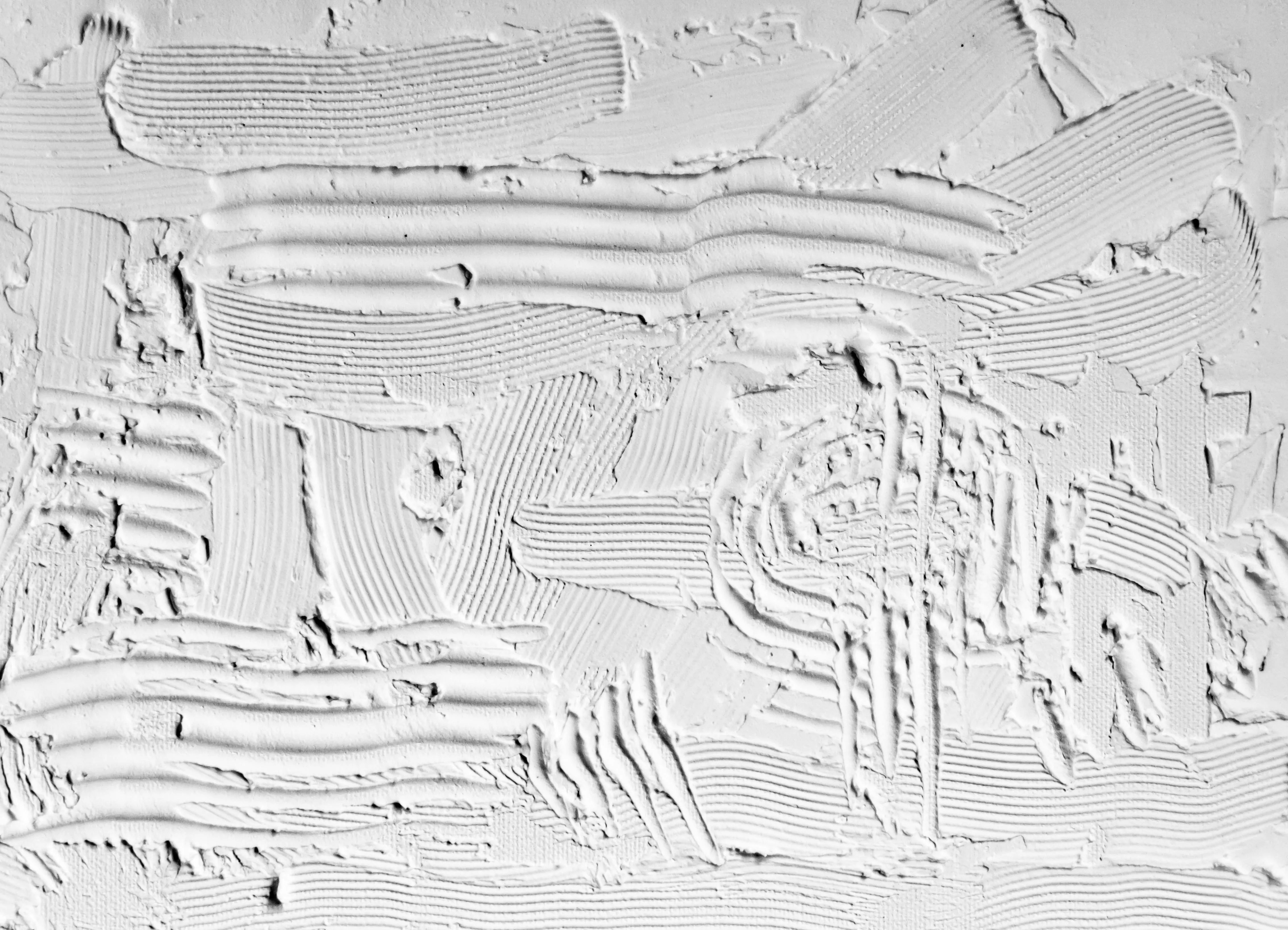 Rough white textured surface with artistic brush strokes