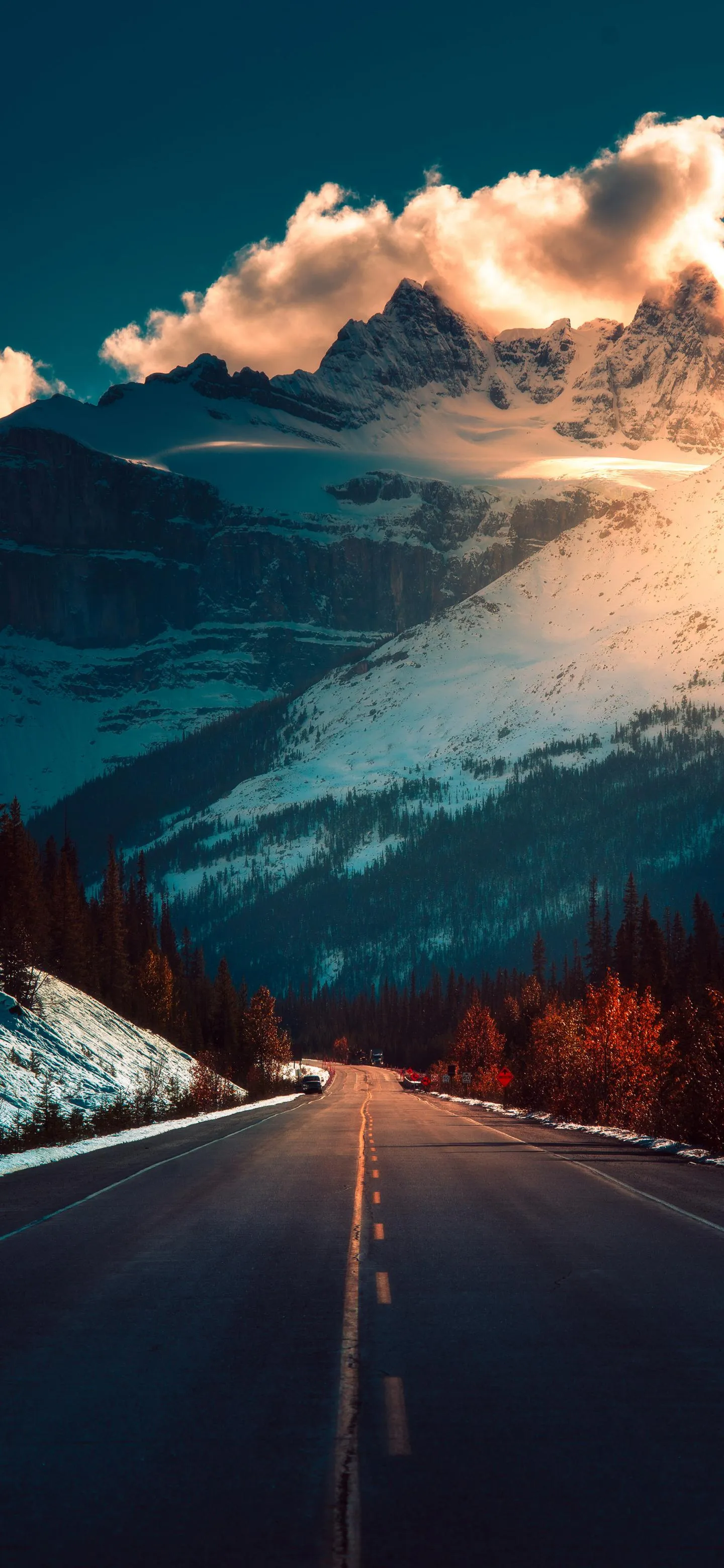 Scenic Road Leads Through Mountains in Stunning Sunset