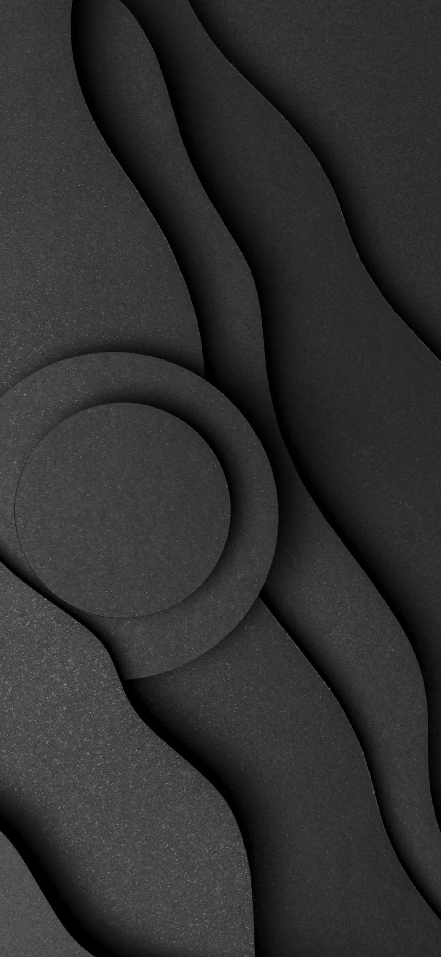 Smooth Black Patterned Surface with Soft Shadows Wallpaper