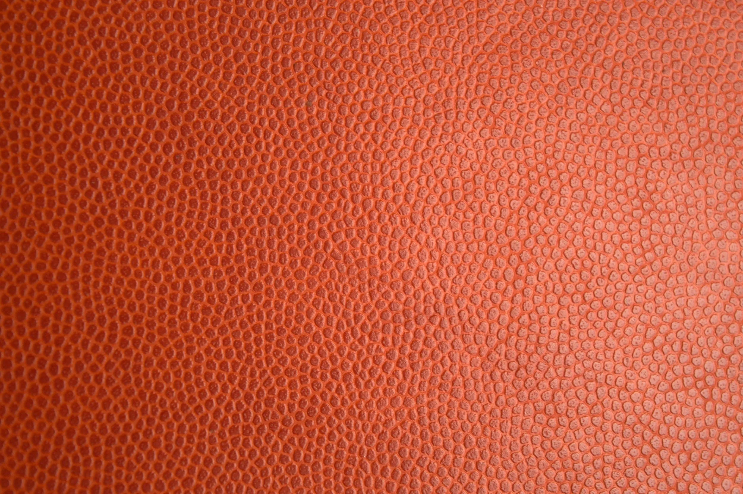 Smooth orange leather texture with fine detail Background