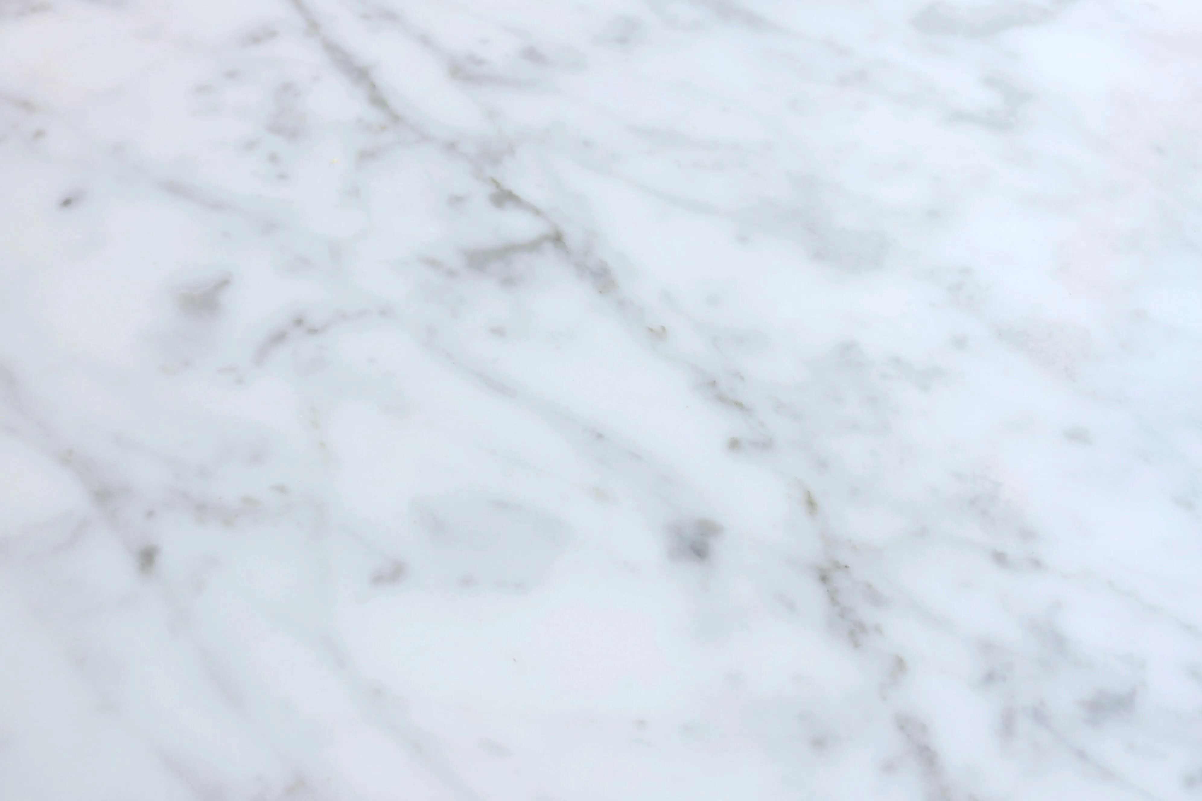 Smooth white marble surface with purple veins Wallpaper