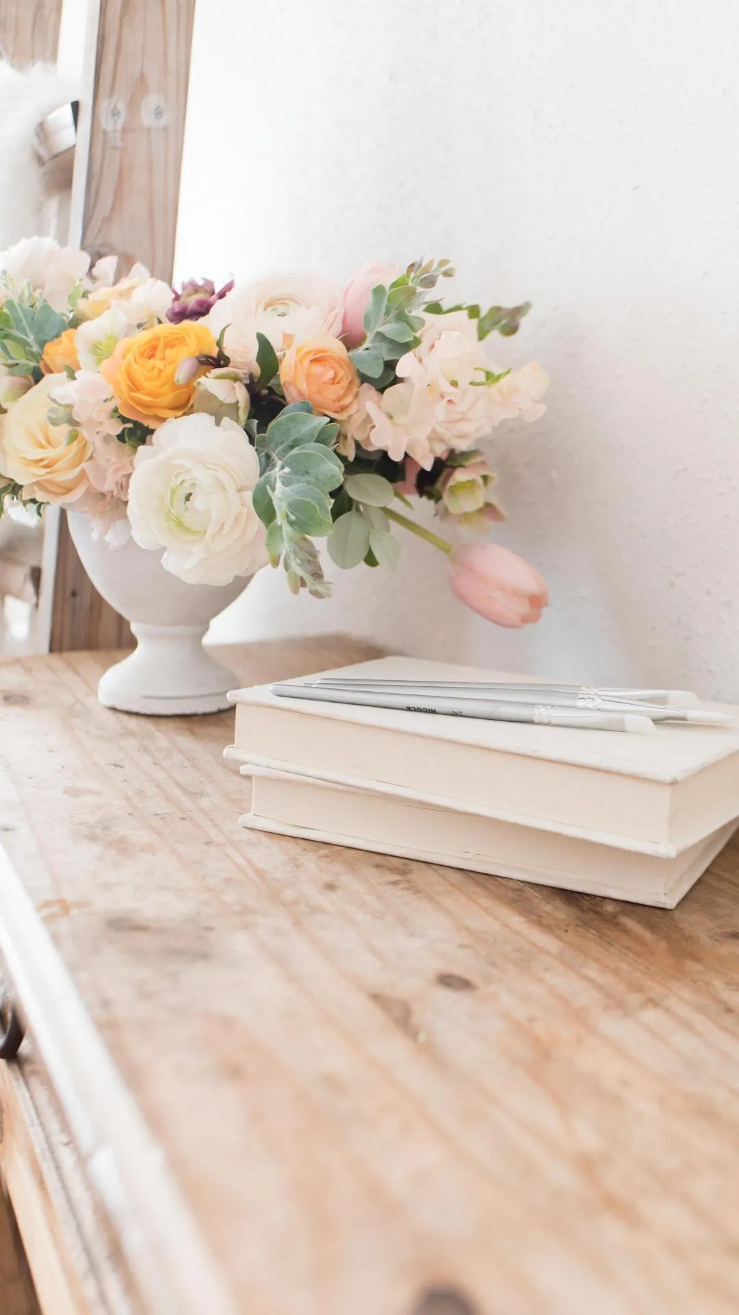 Soft floral background with books and fresh flowers image