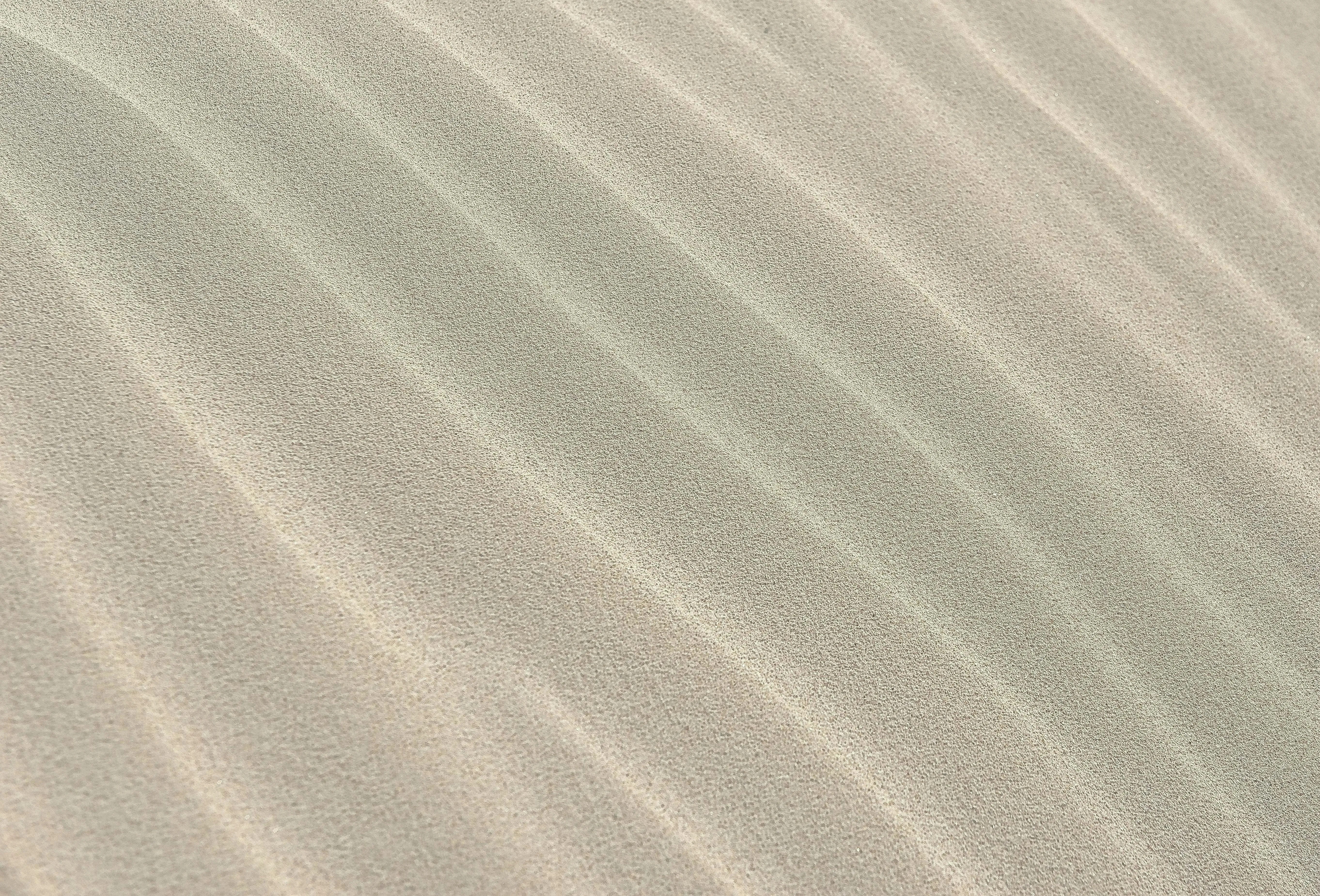 Soft sand dunes with smooth natural wave patterns Wallpaper