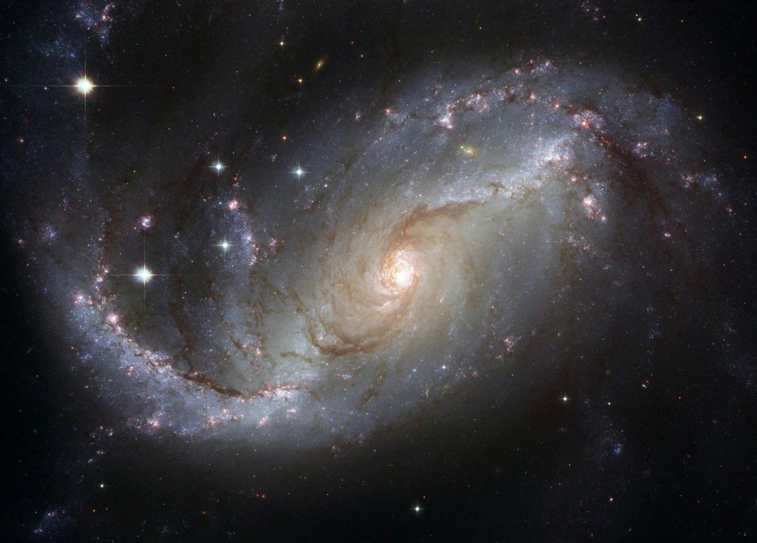 Spiral galaxy glowing with stars in the deep space darkness
