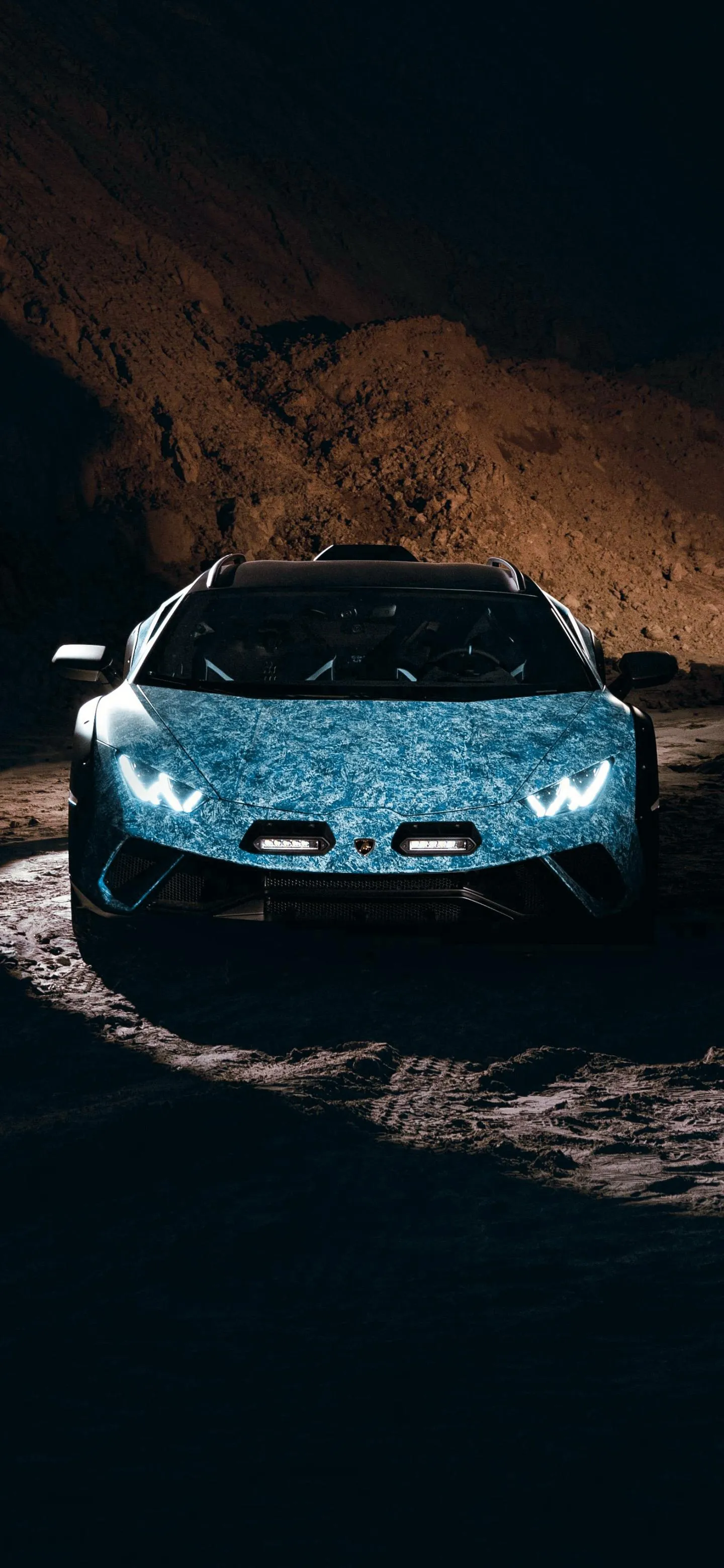 Sports Car in Tunnel with Blue Lights and Shadows Wallpaper