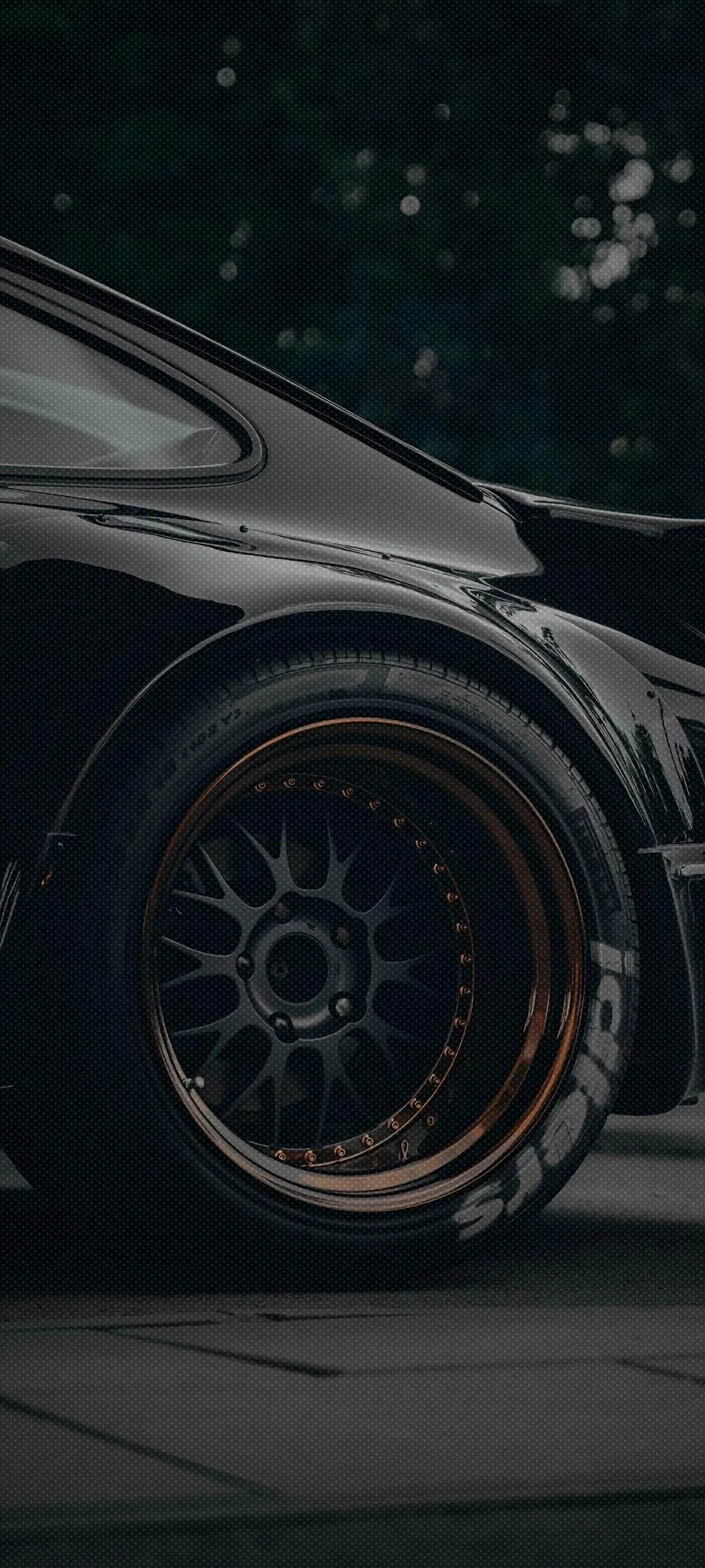 Sports Car Wheel in Focus with Aggressive Style Design
