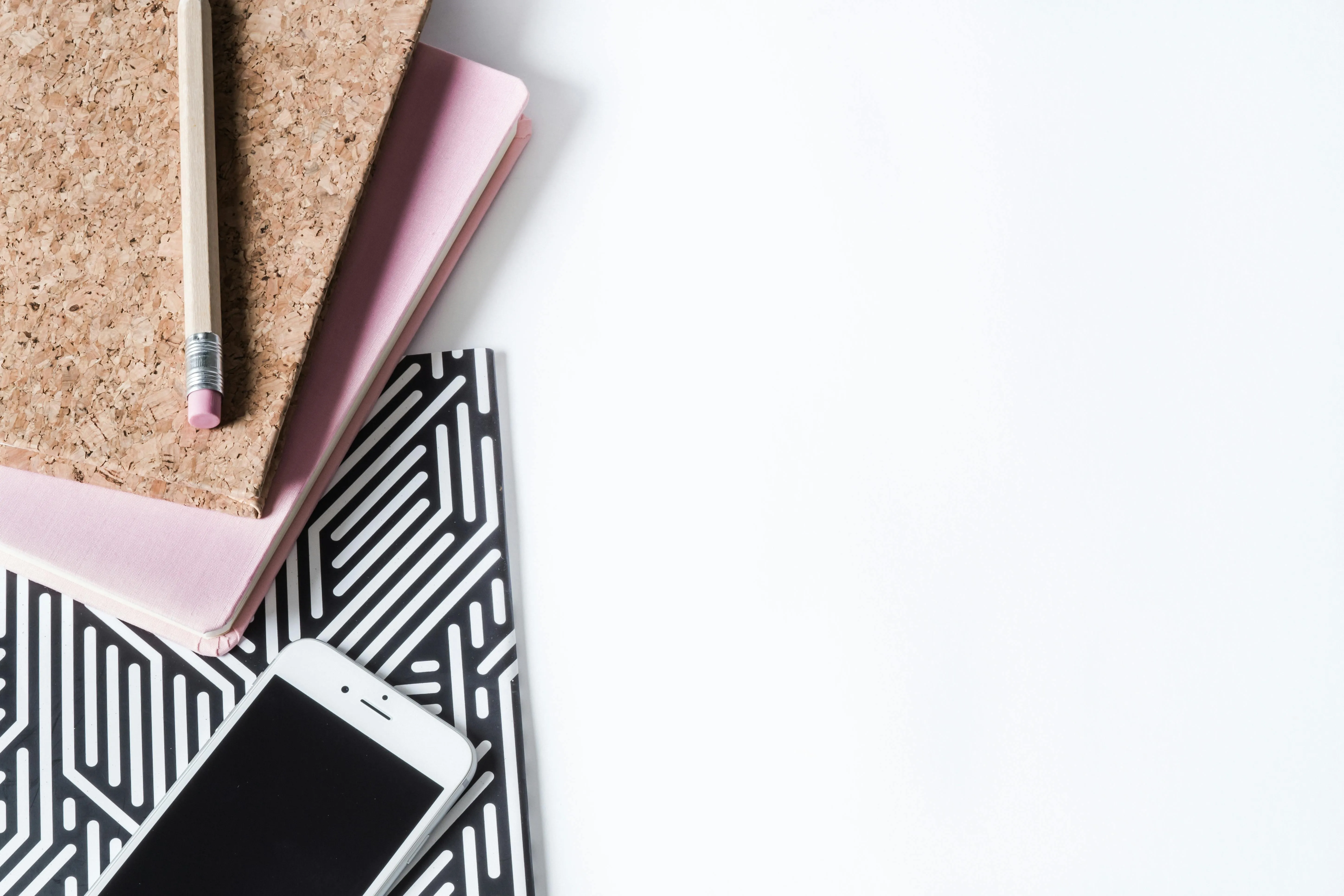Stylish flat lay with notebook phone and pencil on desk 4K