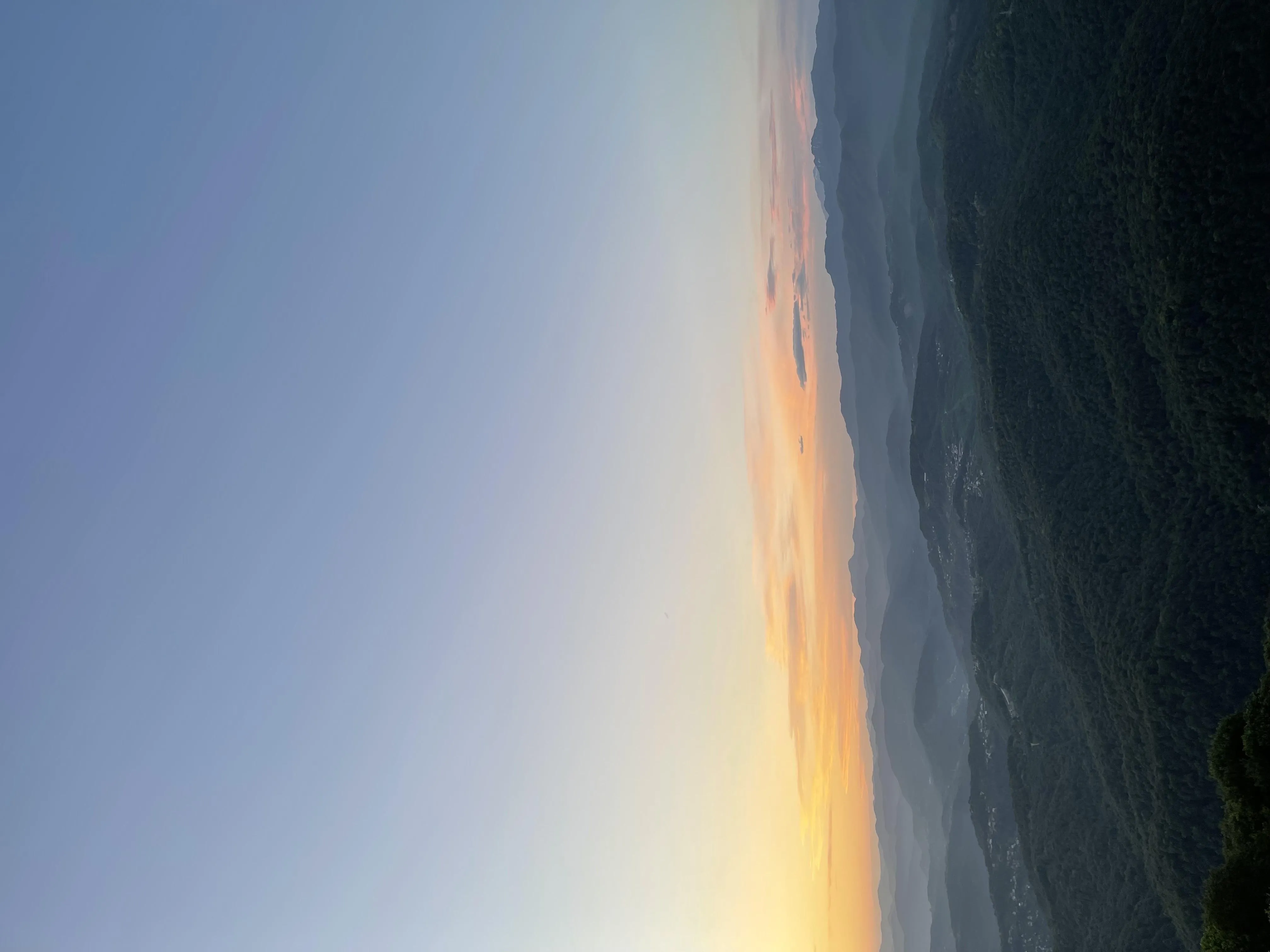 Sunset Horizon over Calm Ocean with Light Reflections