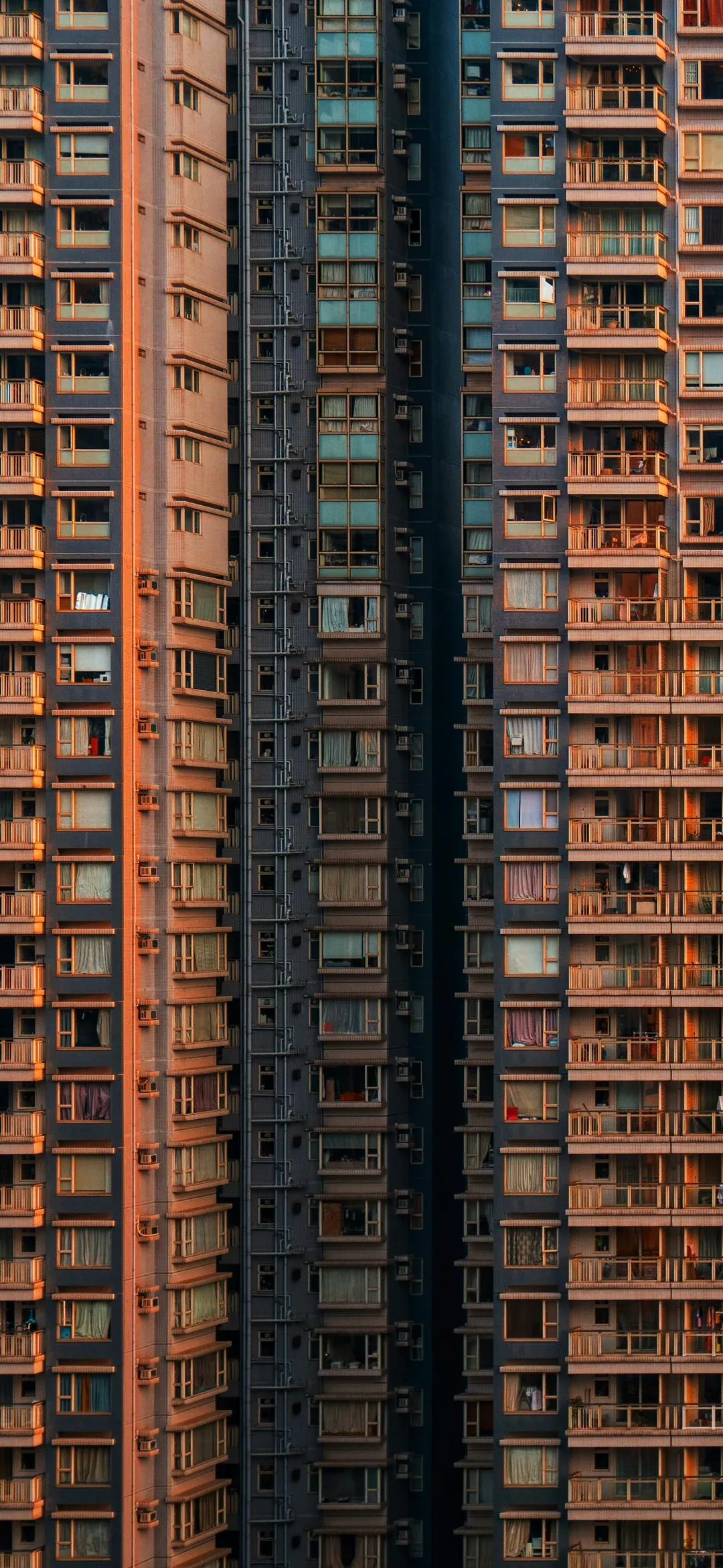Tall Brick Apartment Building in Urban Setting Wallpaper