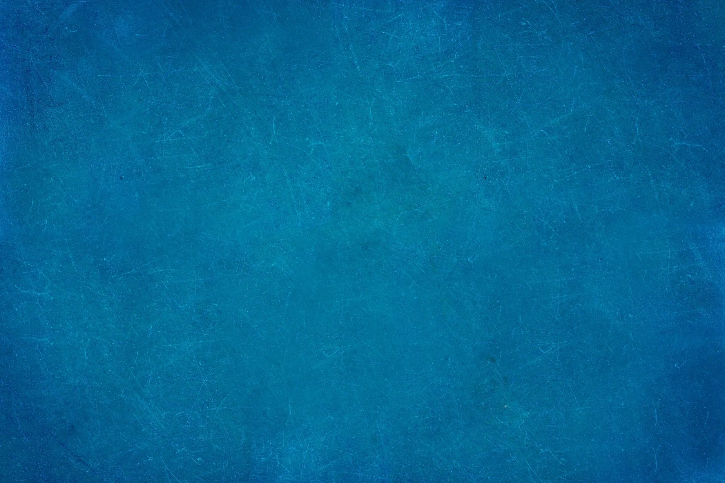 Textured blue background with rough painted surface look