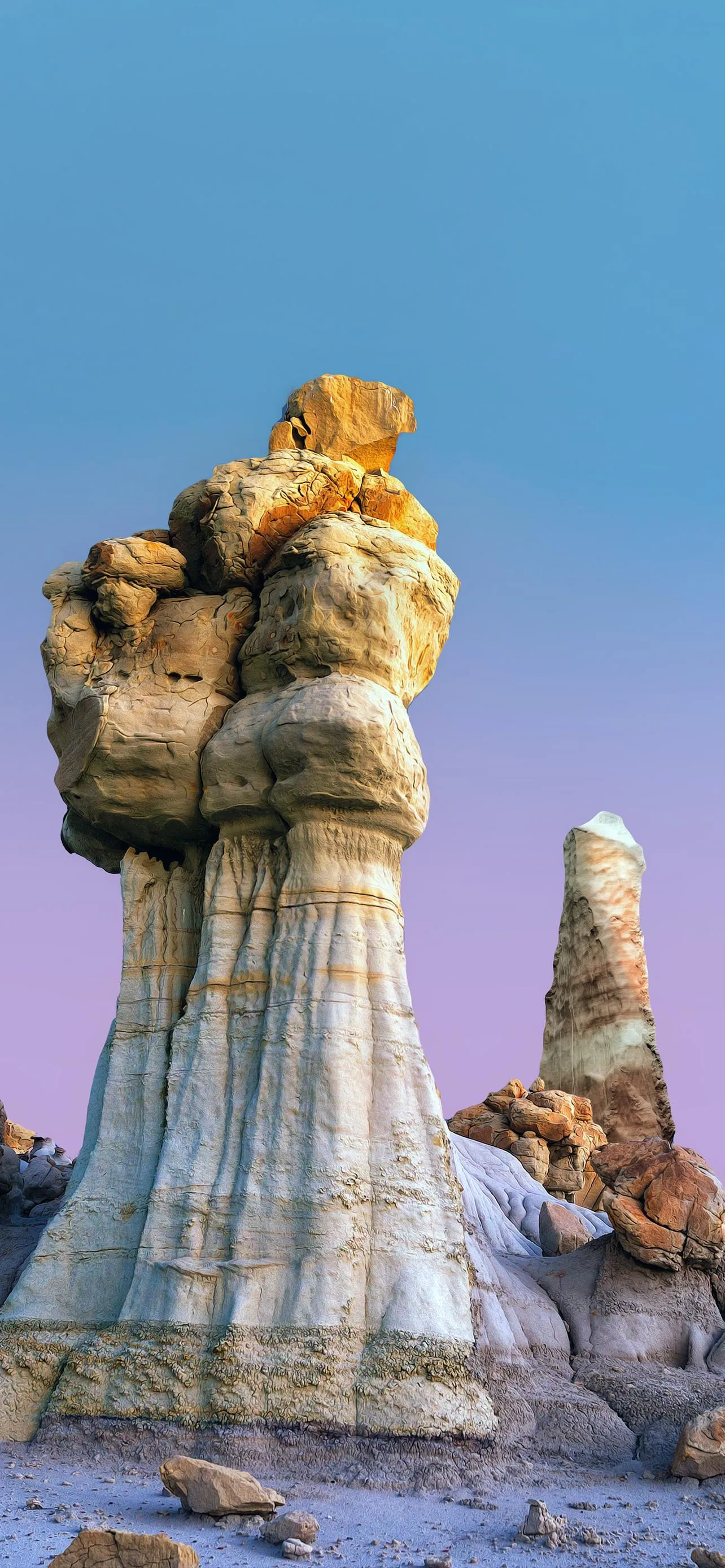 Unique Rock Formation Standing Tall Against Clear Blue Sky